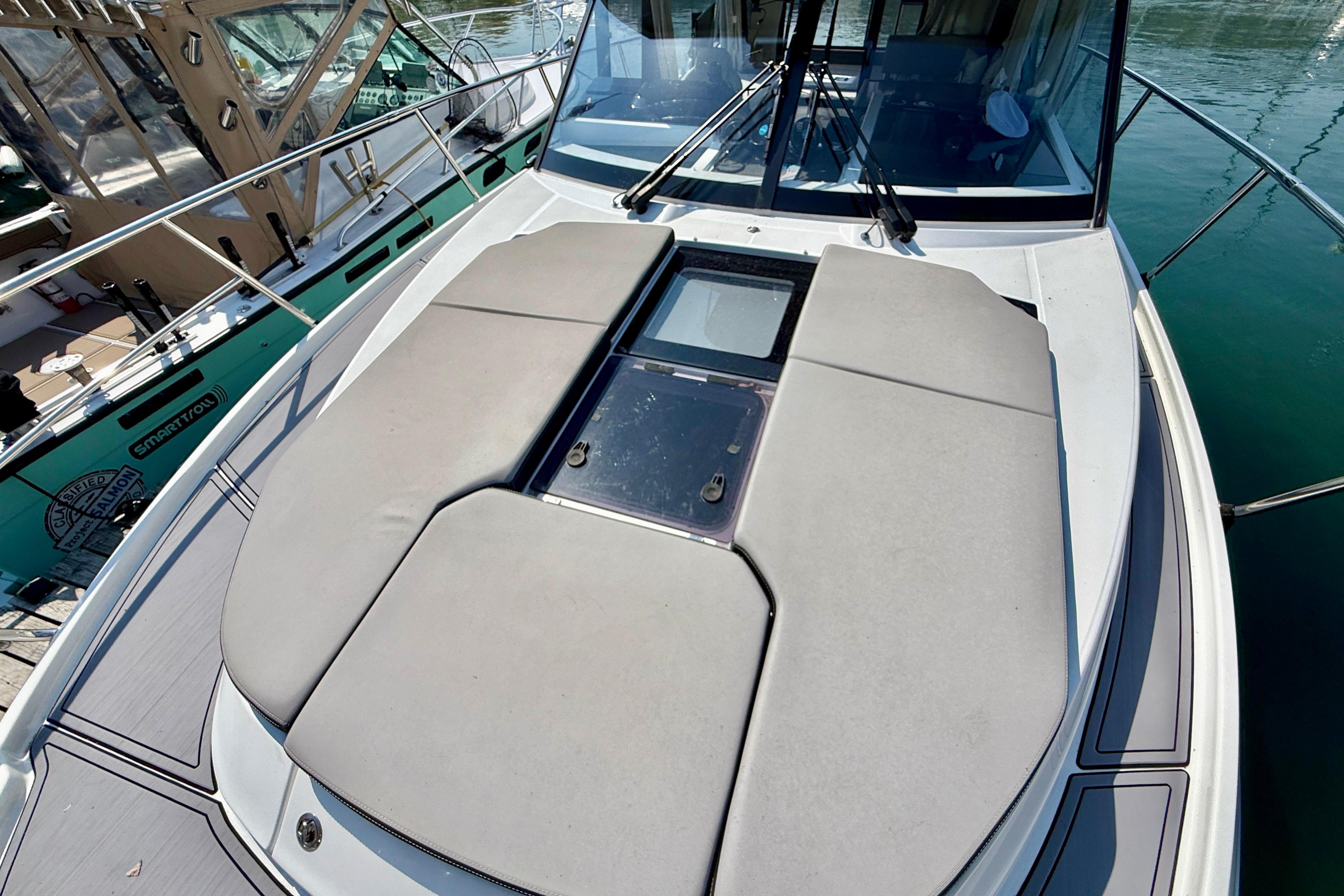 2022 Jeanneau NC 1095 Fly yacht with spacious sunbathing deck on calm waters.