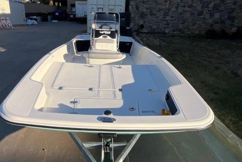 2026 Mako Pro Skiff 15 CC boat on trailer, outdoor setting.