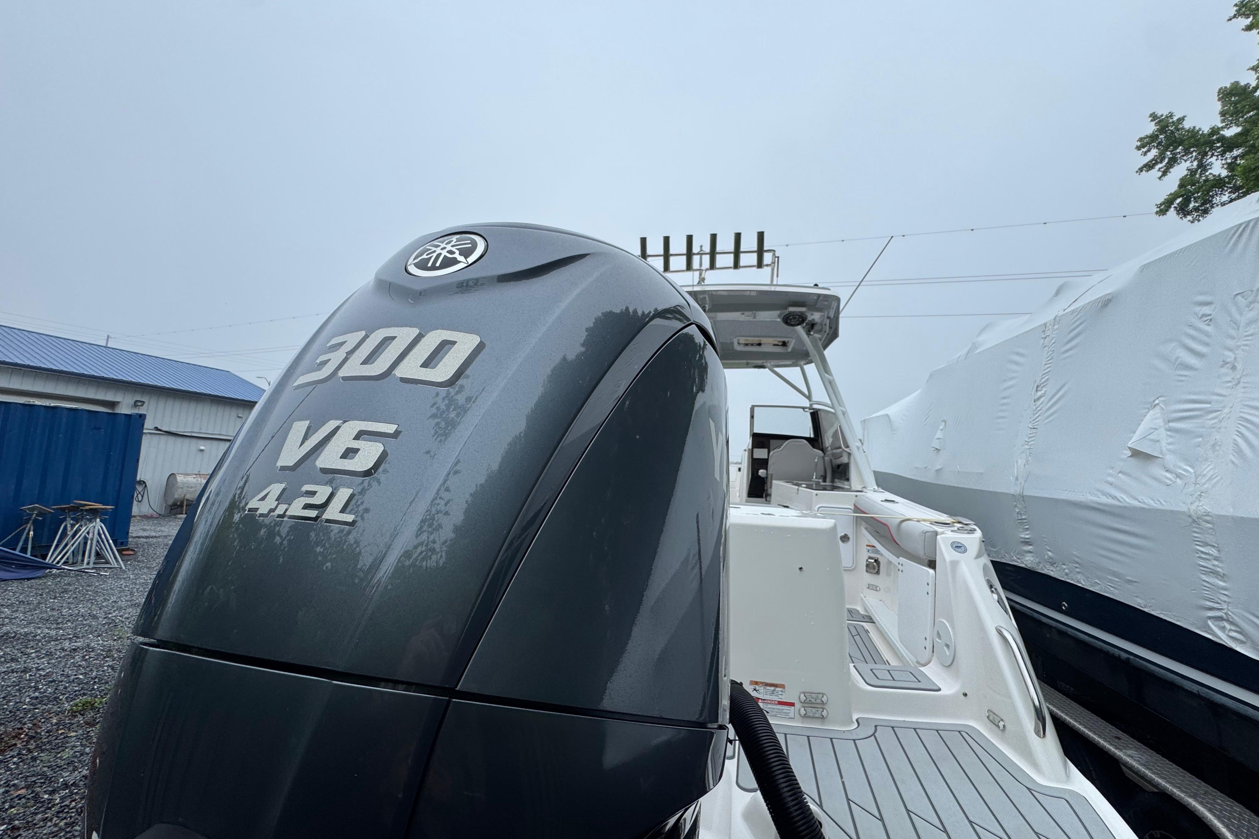 2023 Solara S-250 DC boat with Yamaha 300 V6 4.2L engine in storage.