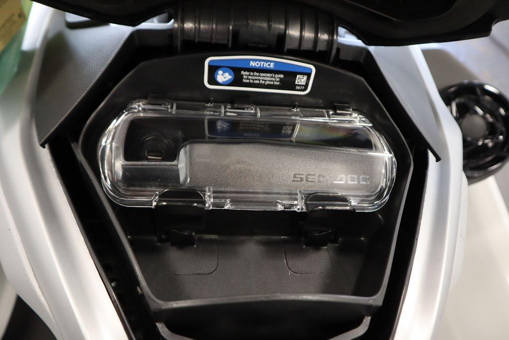2026 Sea-Doo GTX Limited 325 glove box with transparent cover and notice label.