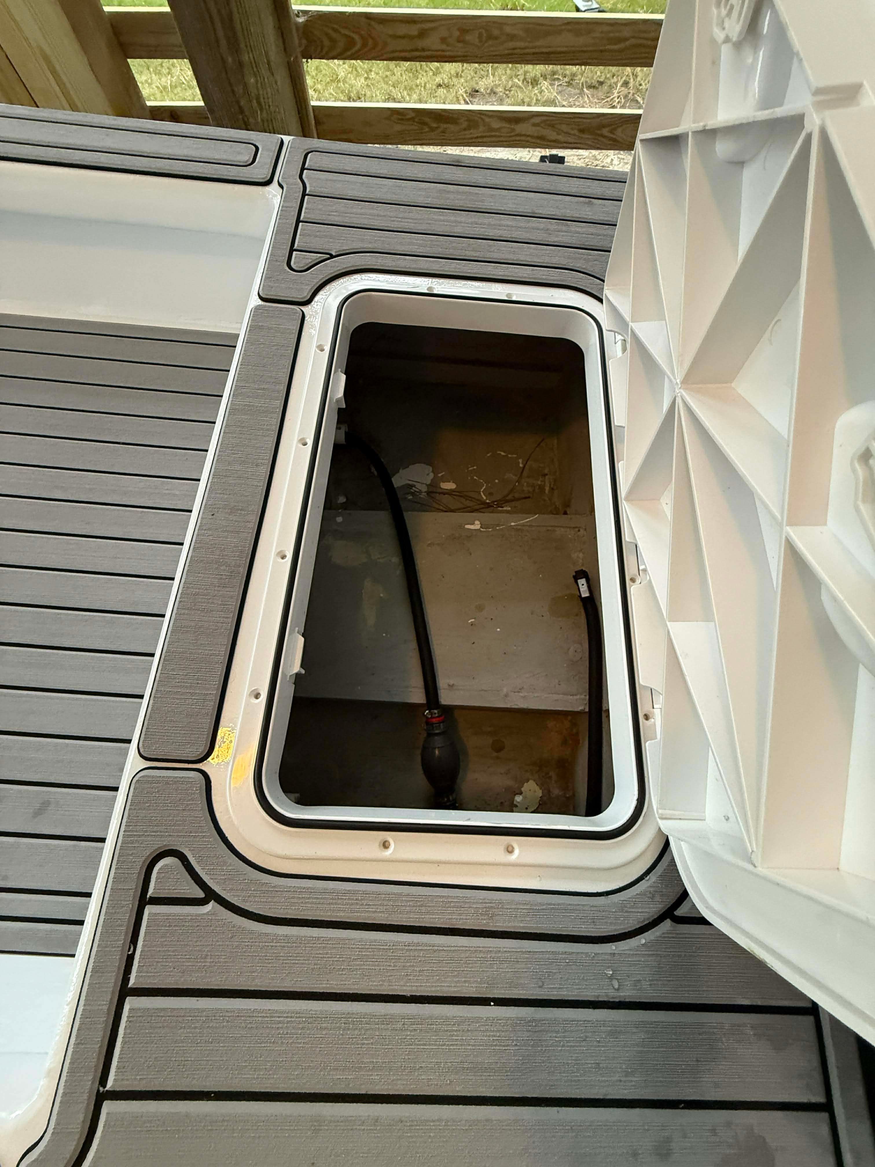 Open storage compartment on a 2023 Skiff Craft boat.