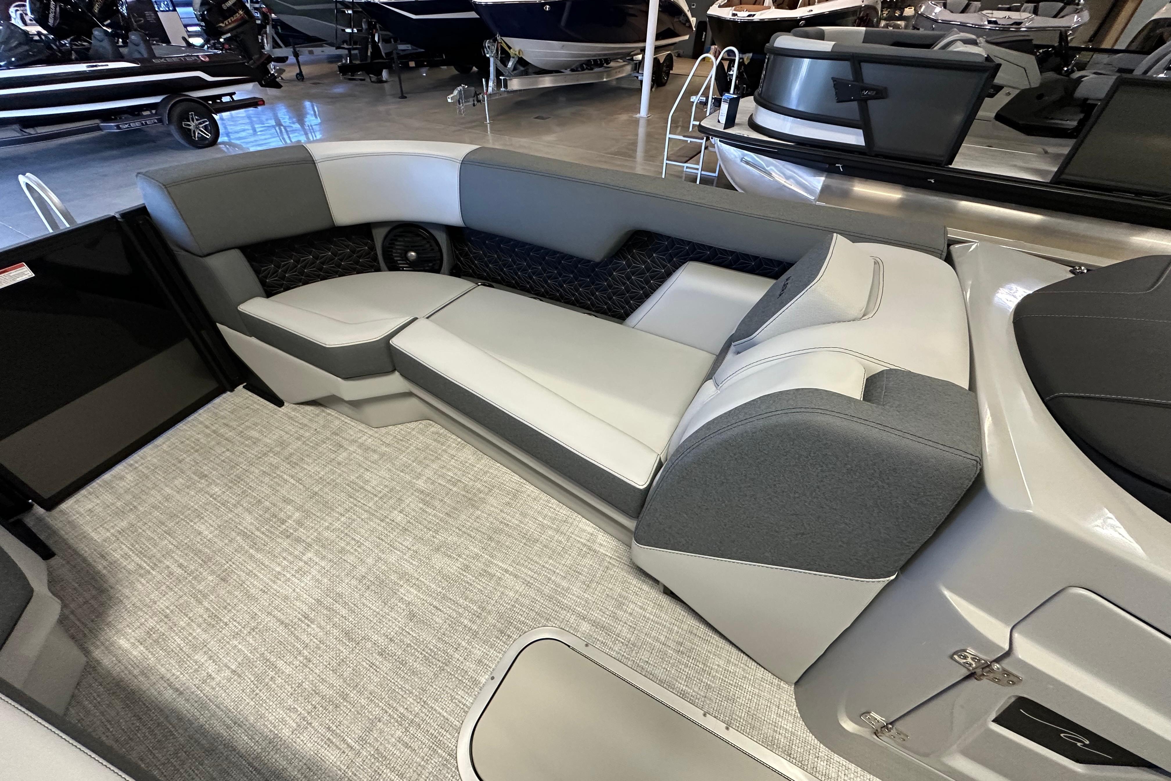 Luxurious seating area in 2026 Alera M25L boat, featuring modern design and comfortable upholstery.