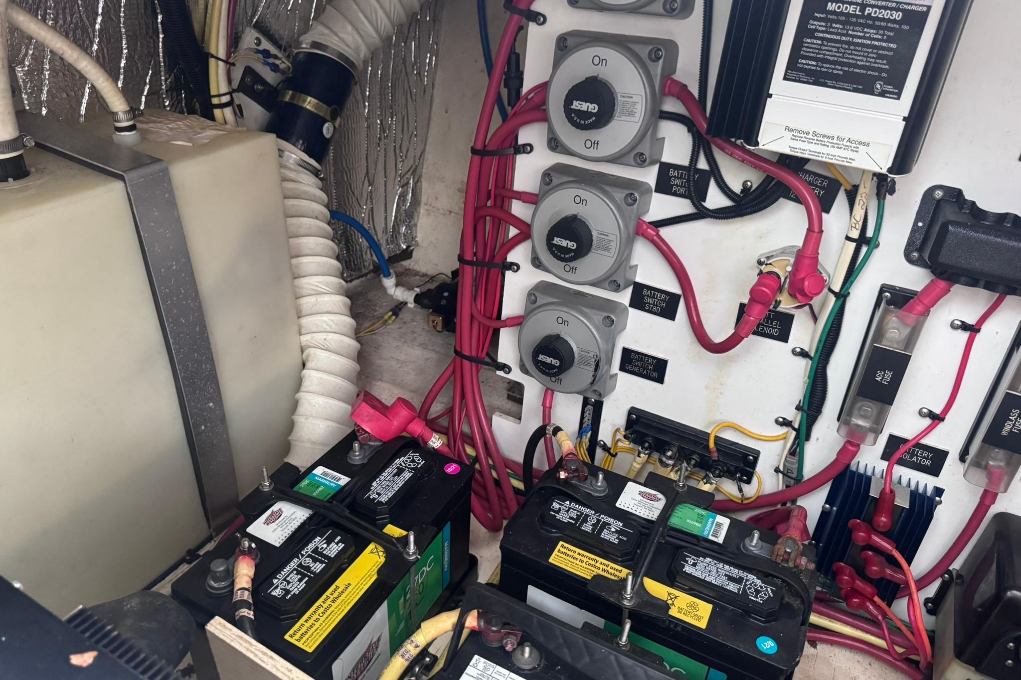Electrical system of a 2002 Cruisers Yachts 3275 Express with batteries and wiring.
