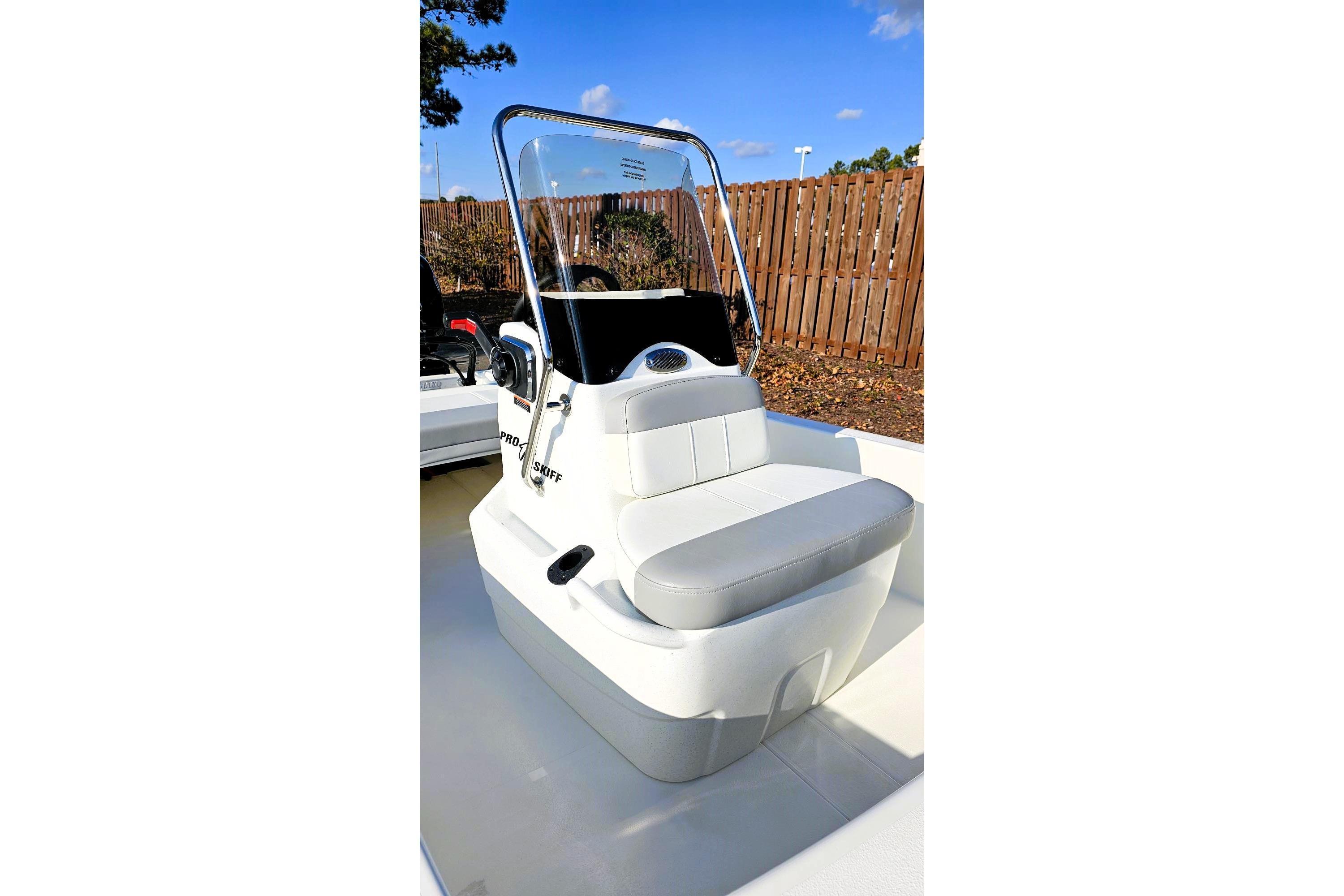 2026 Mako Pro Skiff 13 CC boat with sleek console and seating, outdoors.