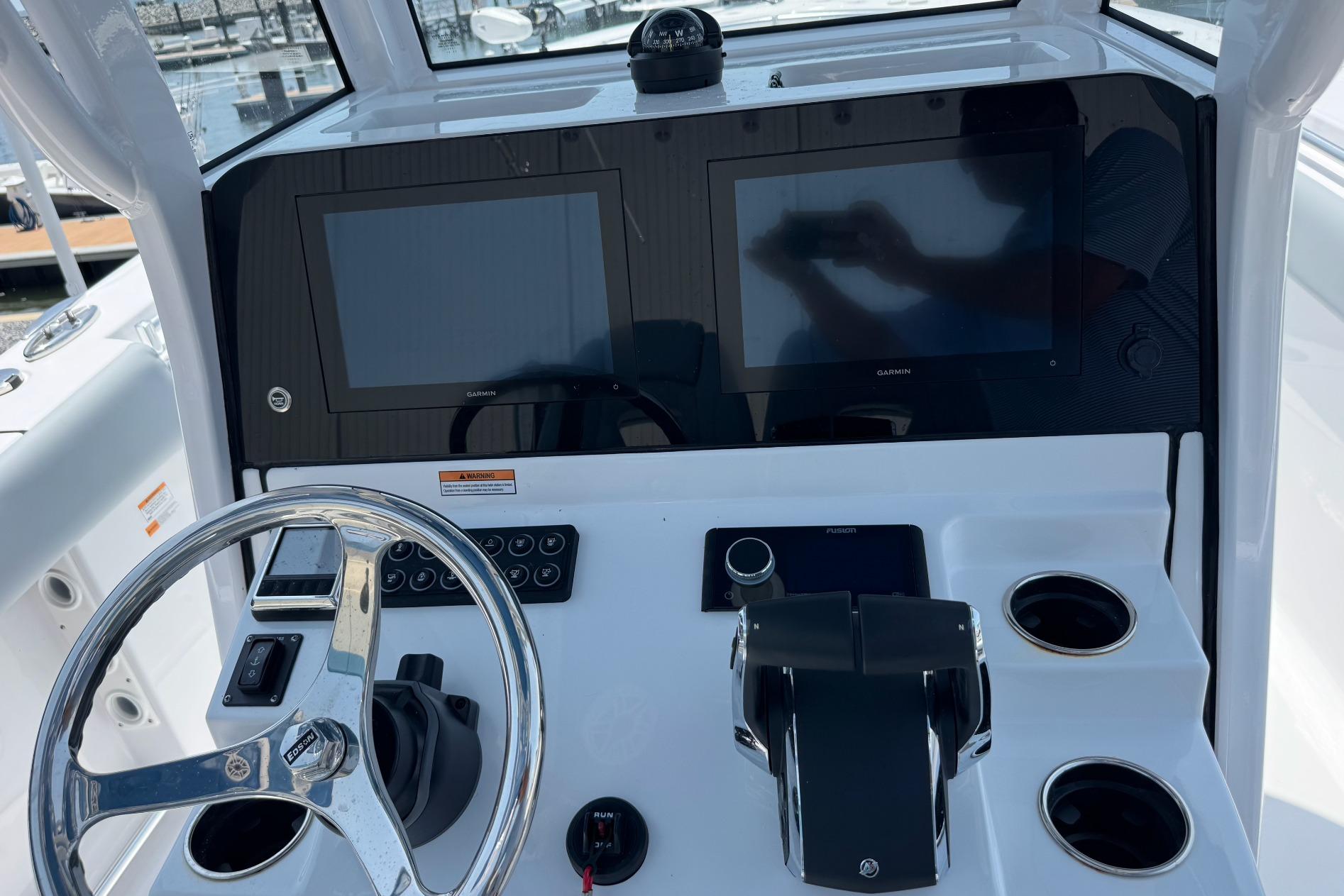 2026 Sportsman Open 262 Center Console dashboard with dual screens and steering wheel.