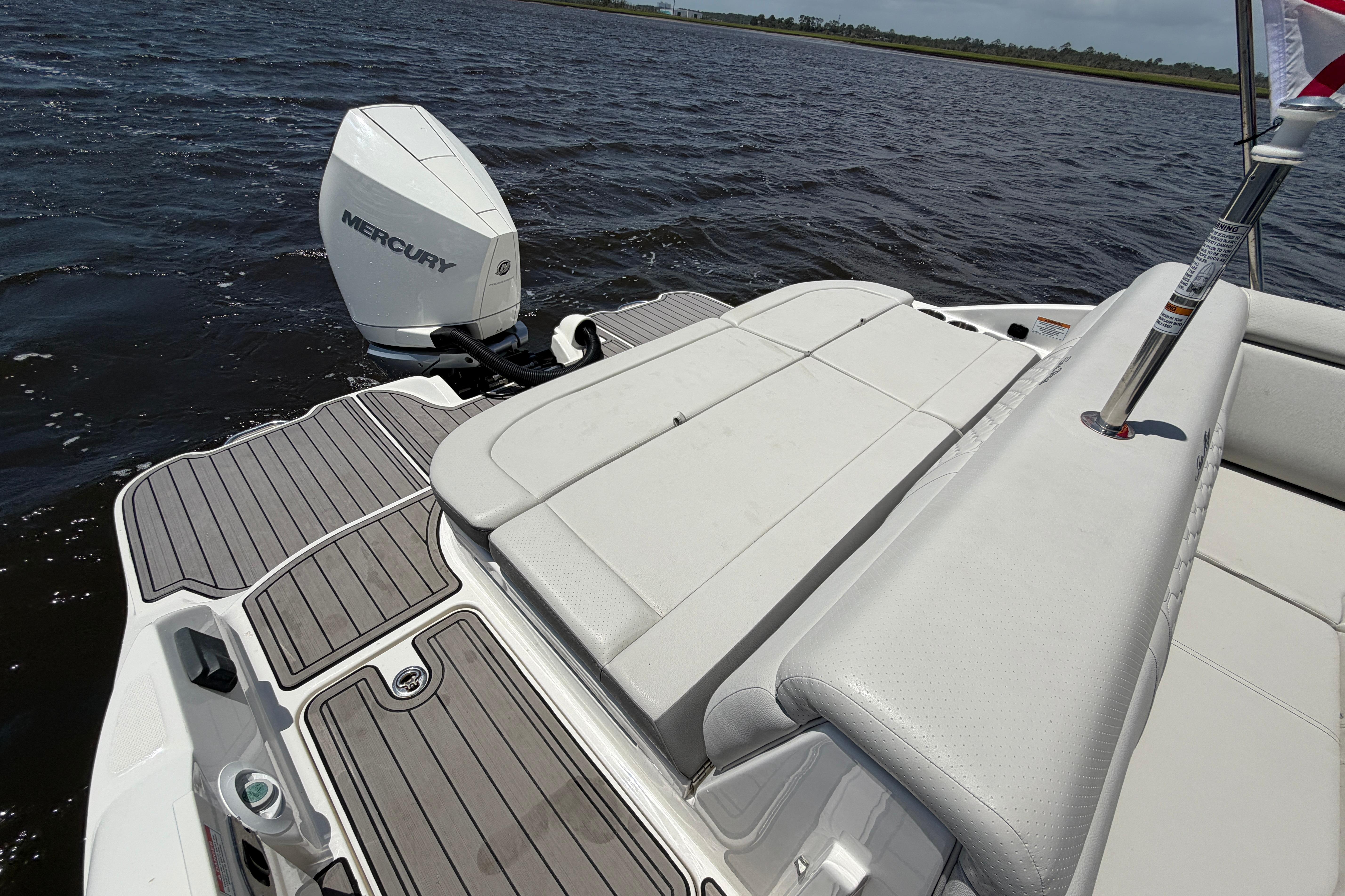 2024 Sea Ray SDX 270 Outboard boat with Mercury engine on water.