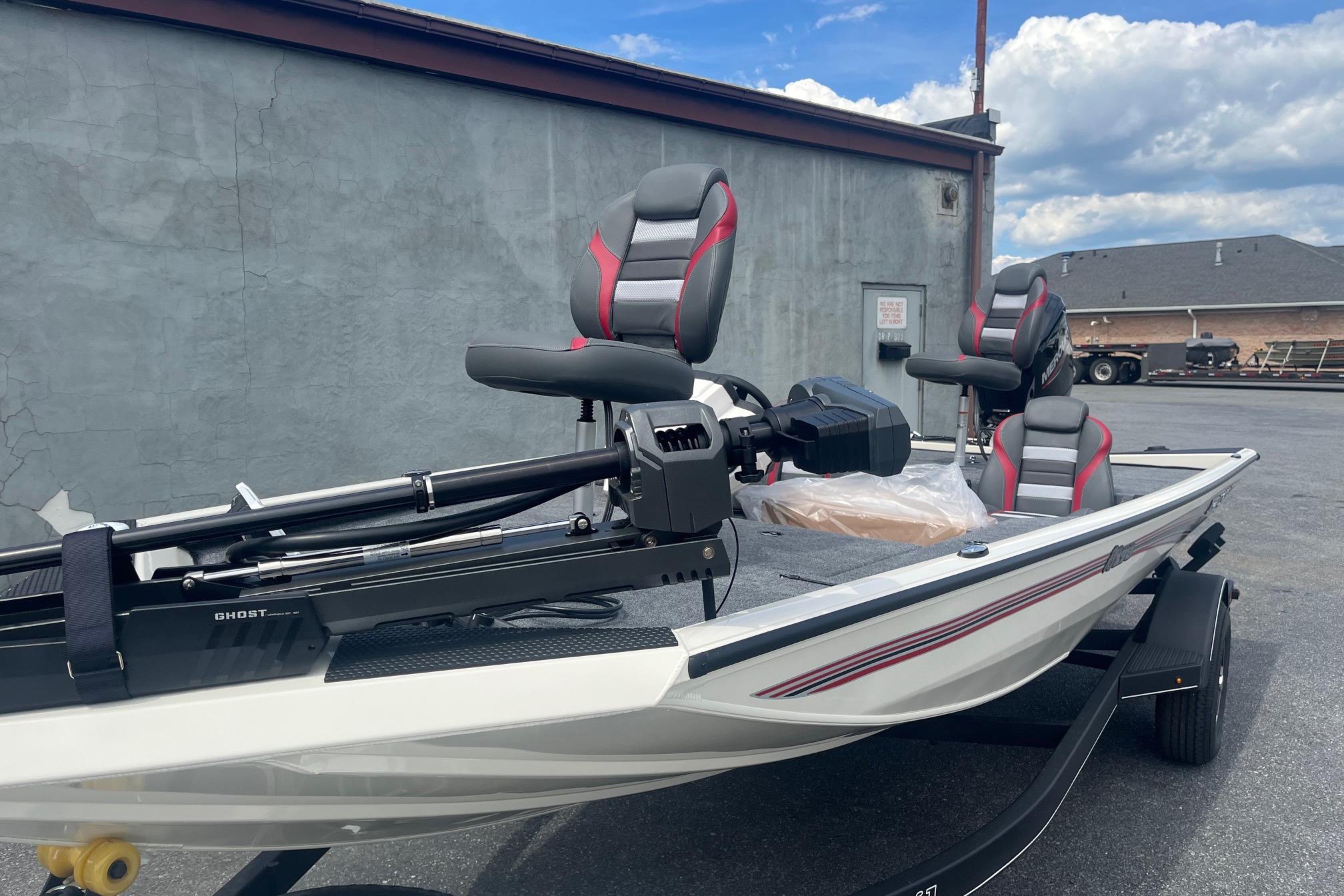 2025 Ranger RT178 boat with modern seating and trolling motor, parked outdoors.