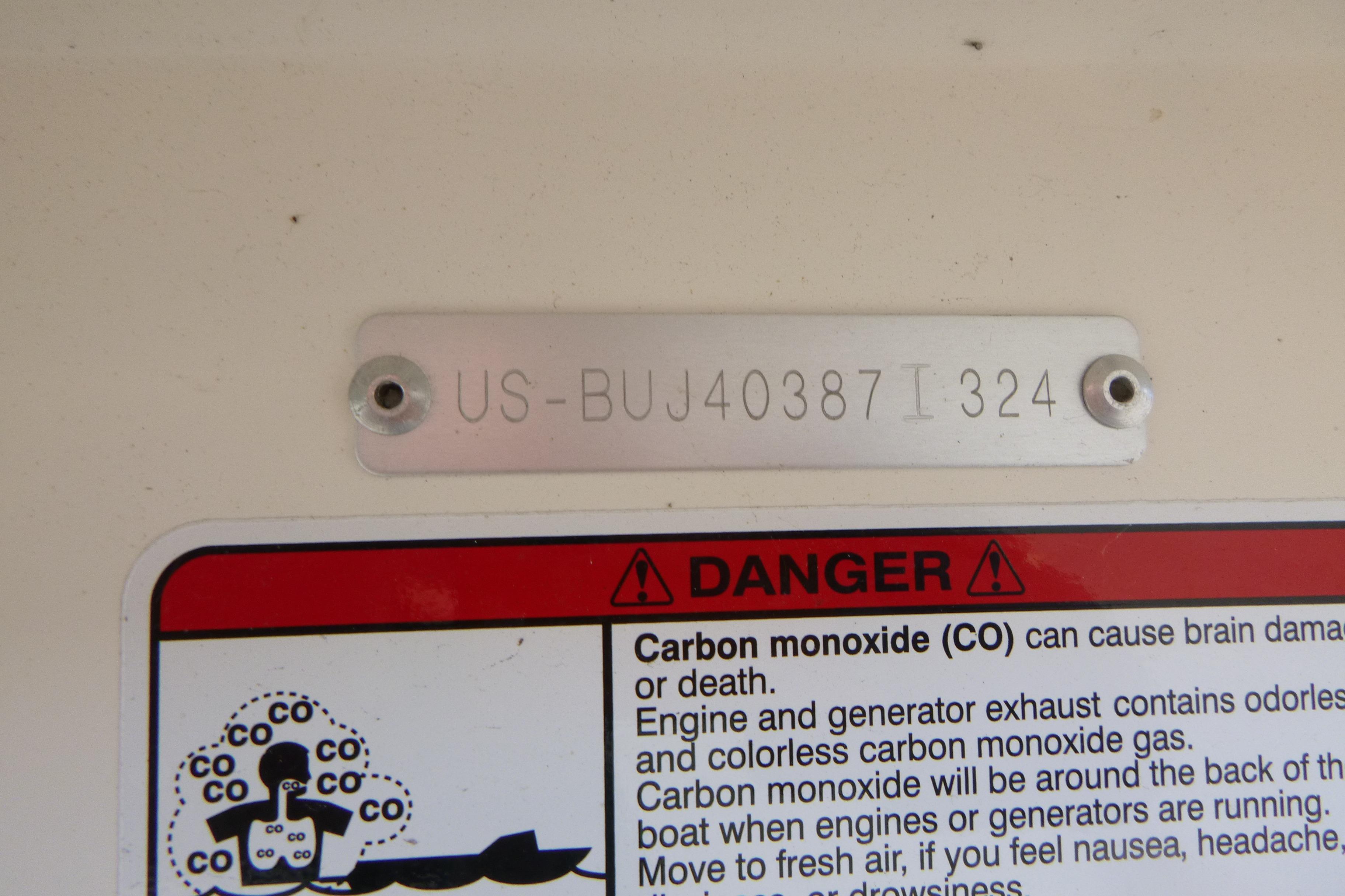 2024 Mako Pro Skiff 17 CC warning label and serial number plate.