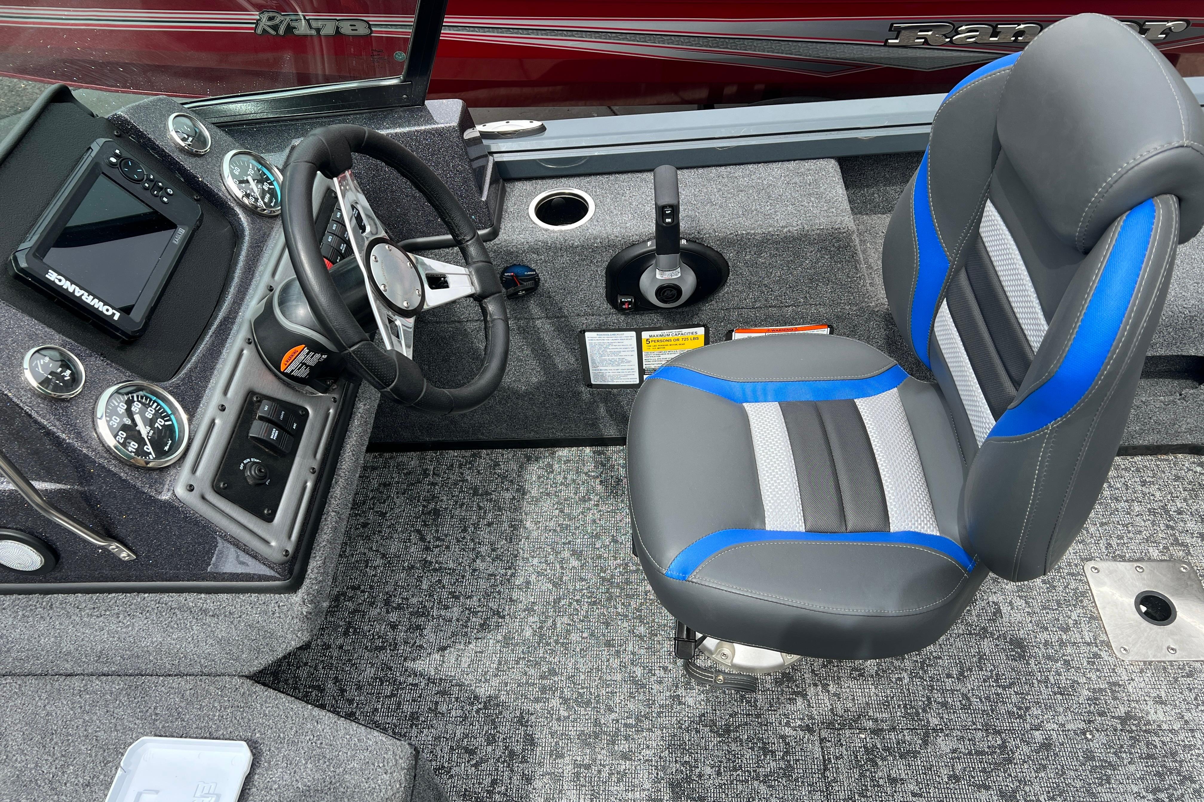 2026 Ranger VS1682SC Angler boat cockpit with steering wheel, control panel, and cushioned seat.