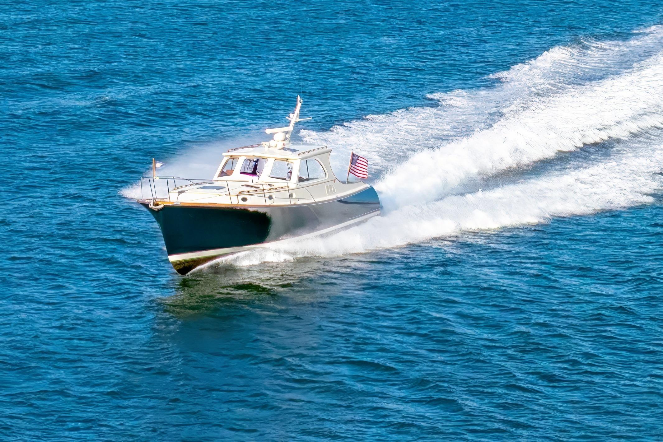 1999 Hinckley Talaria 44 Express cruising on open blue water.