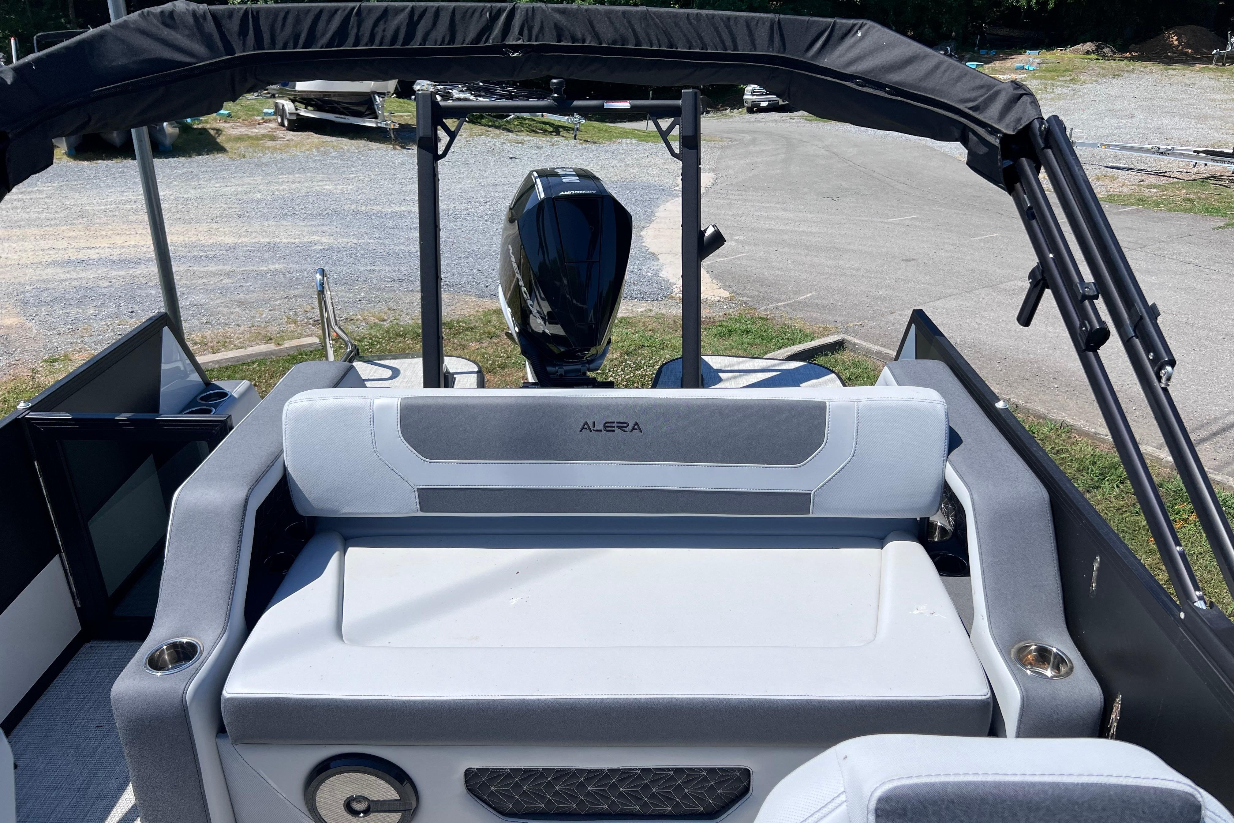 Alera M23L 2026 boat interior with seating and motor, showcasing modern design.