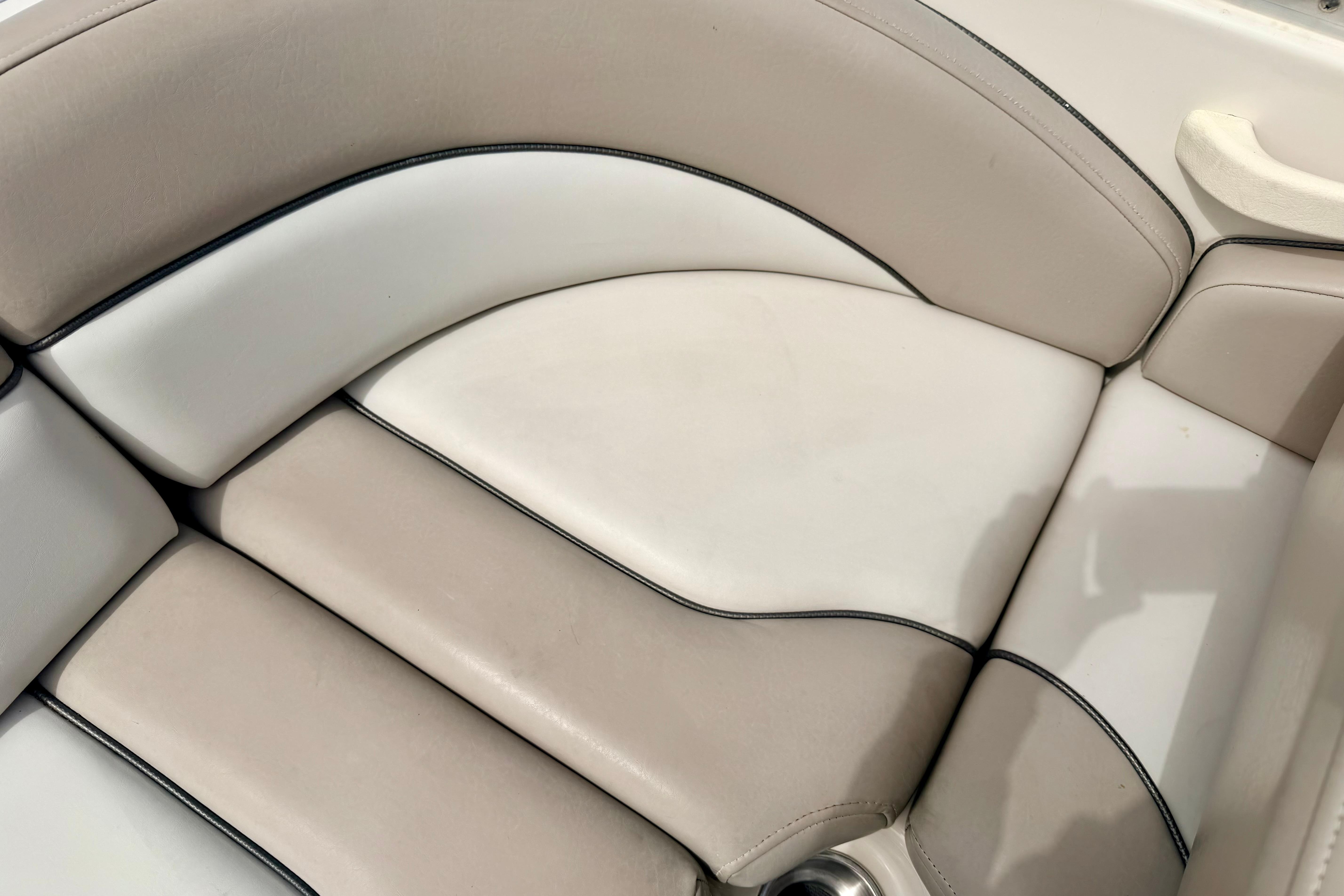 Cream and white seating on a 2003 Sea Ray 200 Sundeck boat.