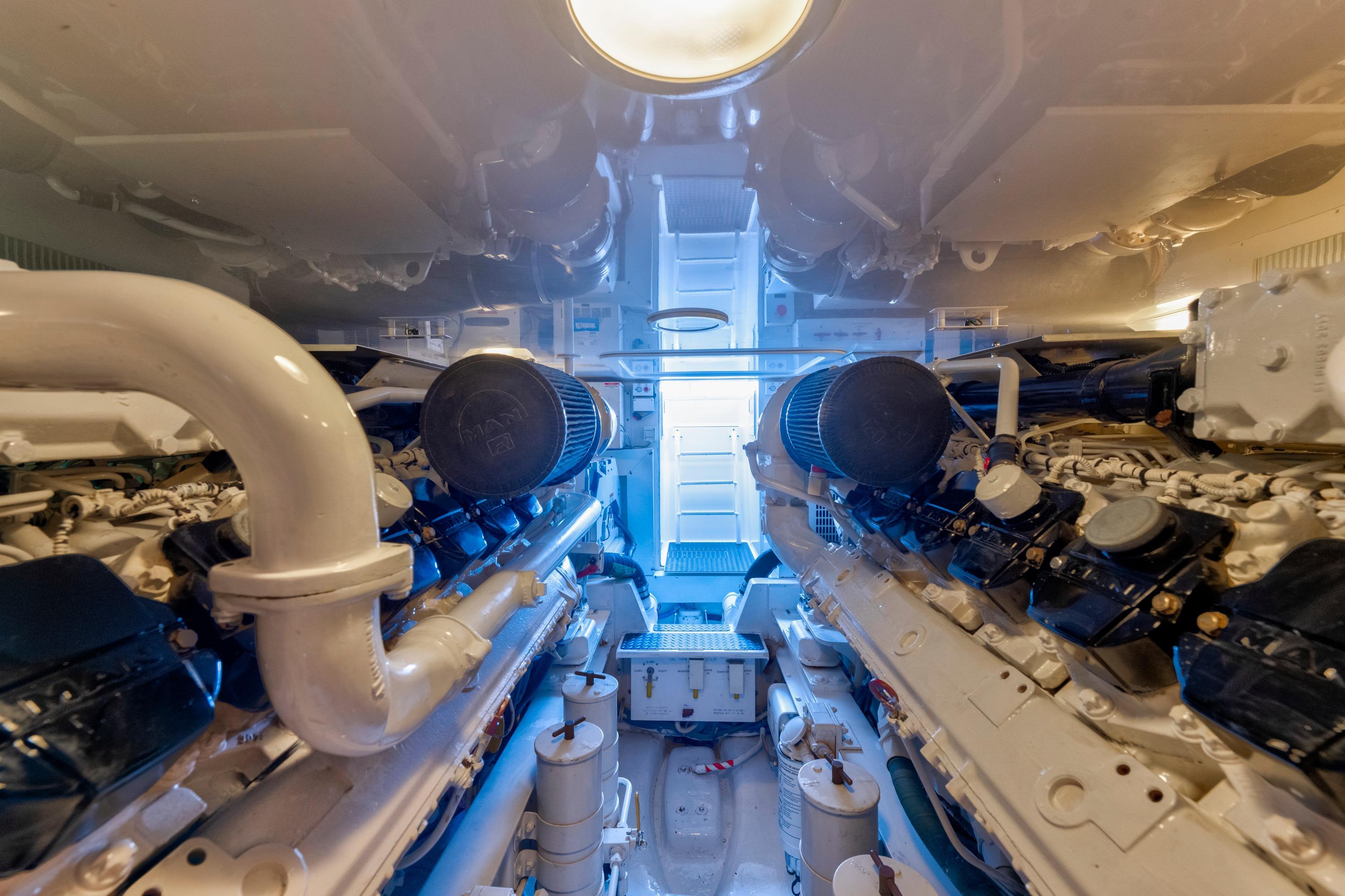 Engine room of 2009 Viking 50 Convertible yacht, showcasing dual engines and mechanical components.