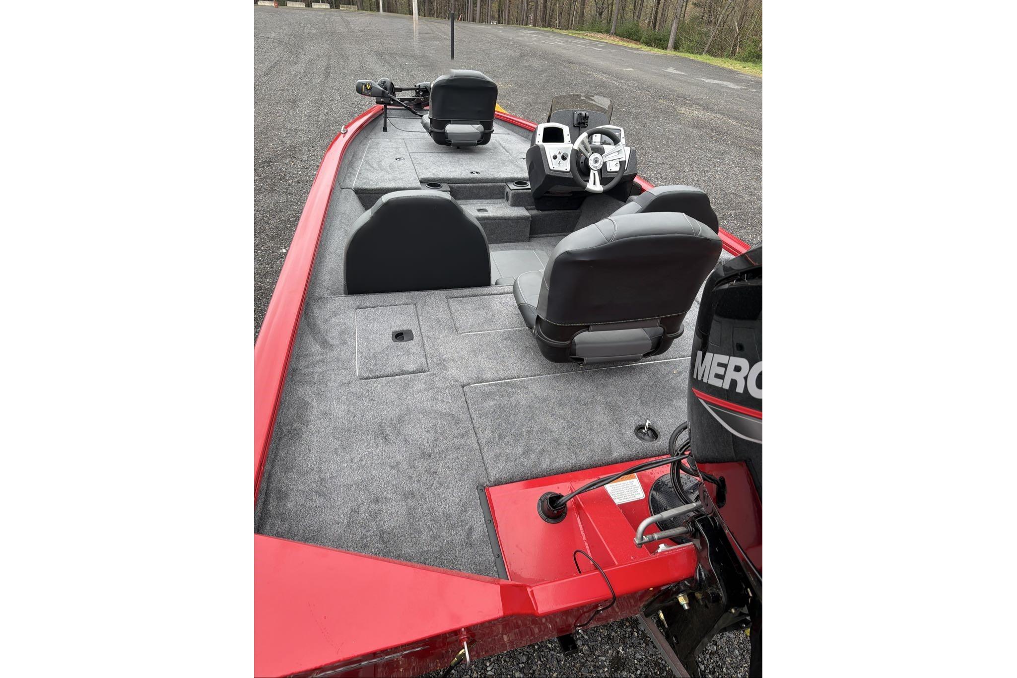 2026 Tracker Pro Team 175 boat interior with steering console and seating.
