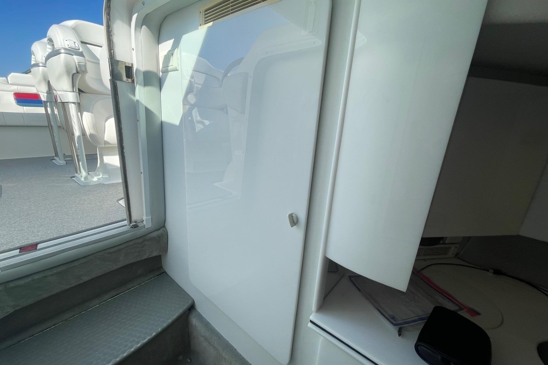 Interior view of a 2004 Formula 382 FASTech boat, featuring seating and cabin entry.