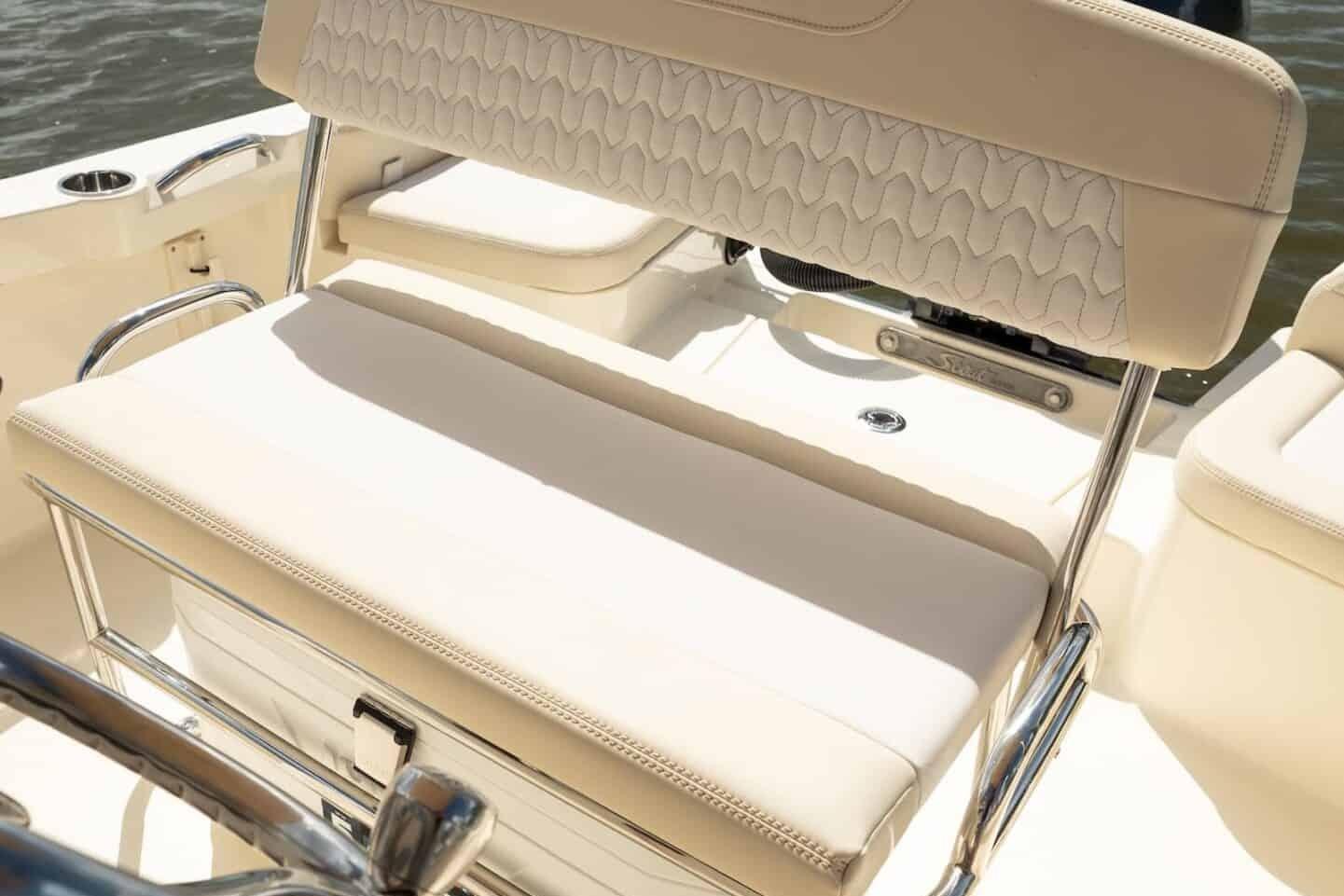 2026 Scout 188 Sportfish boat interior with beige seating and stainless steel accents.