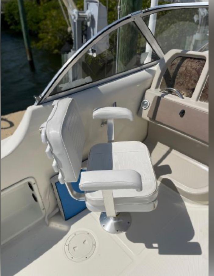 Interior of a 2002 World Cat 246 DC boat with white seating.