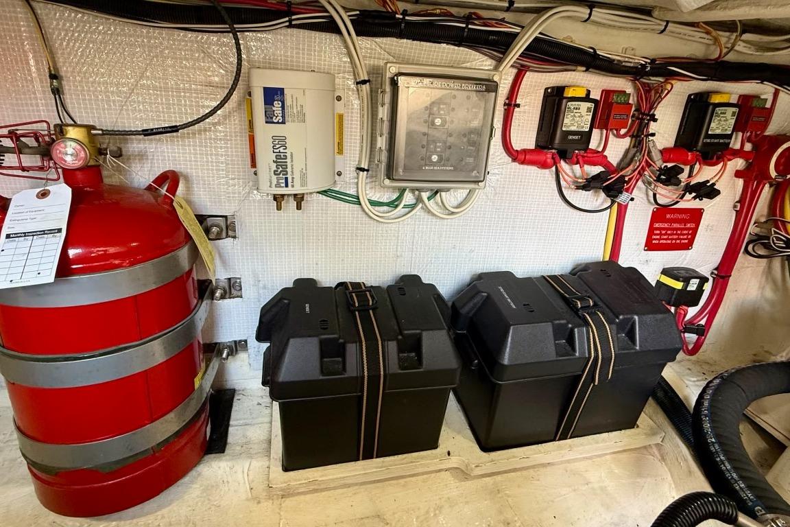 Engine room of 2015 Sabre 38 Salon Express with fire extinguisher and electrical components.