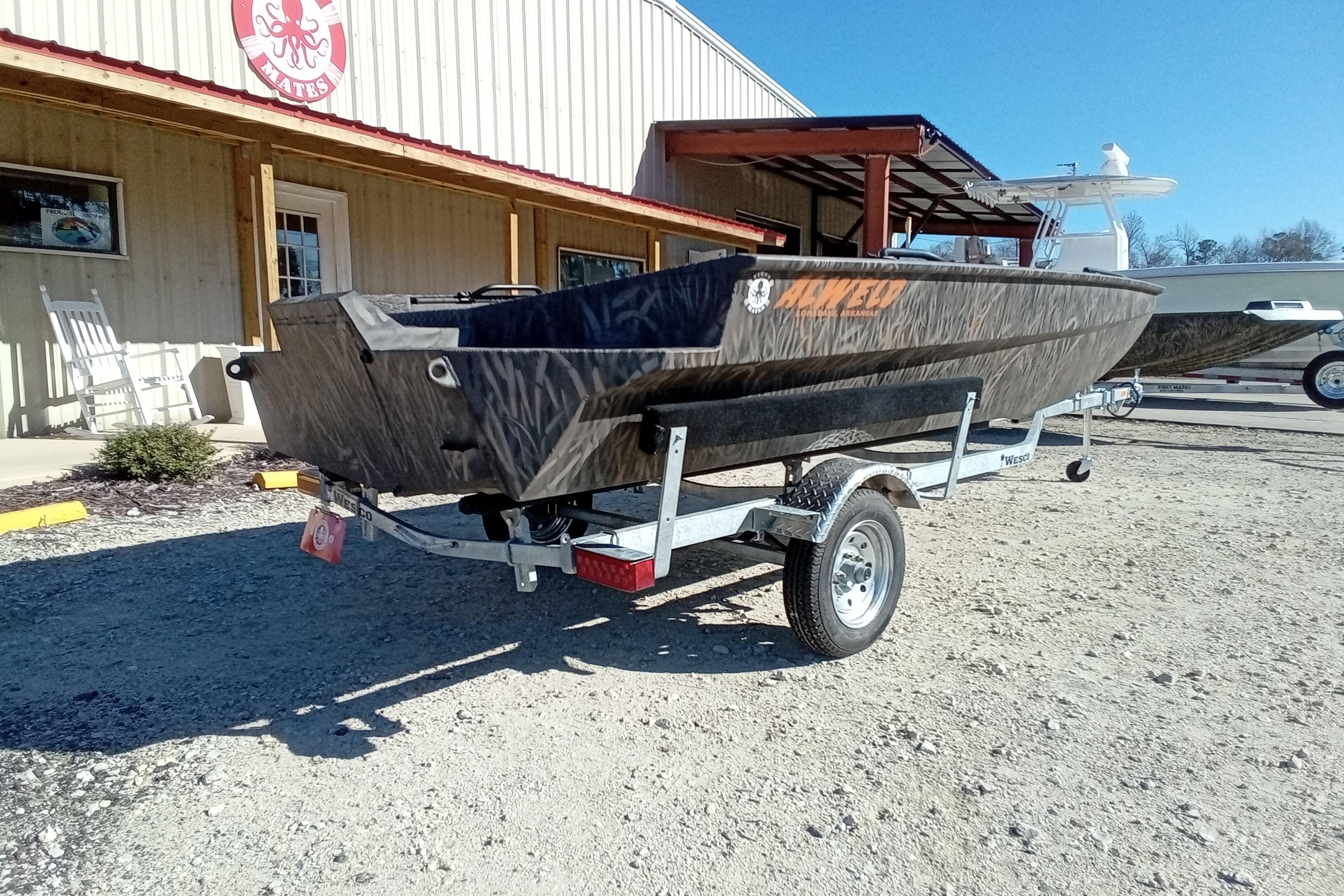2026 Alweld 1652 Invader boat on trailer, parked outside a building.