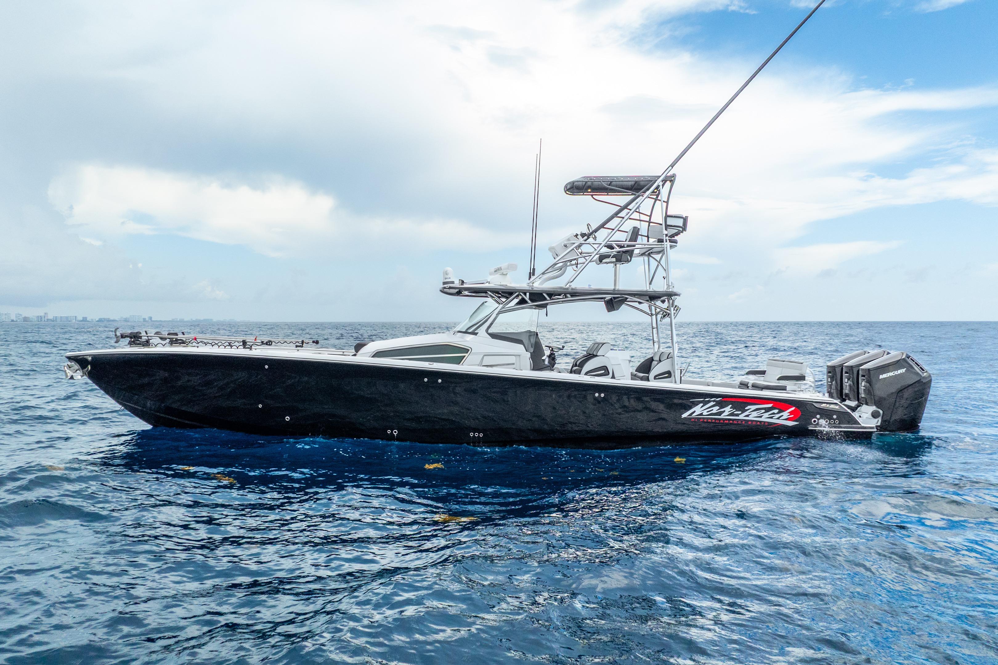 2024 Nor-Tech 452 Super Fish boat on open ocean under cloudy sky.