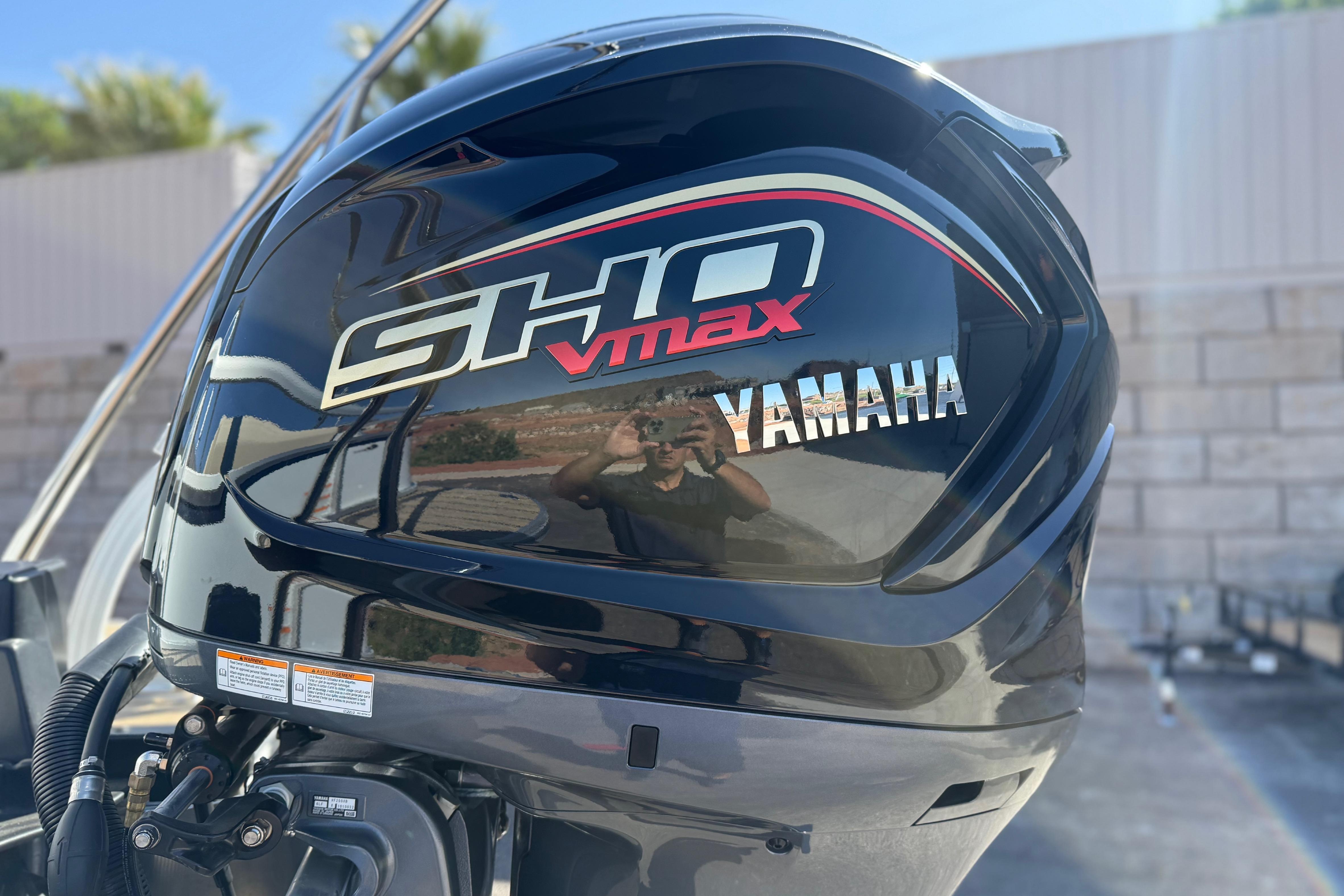 Yamaha SHO VMAX engine on 2026 SunCatcher Select 322SL boat, outdoor setting.