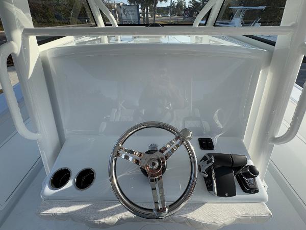 2025 Yellowfin 39 Offshore boat helm with steering wheel and controls.