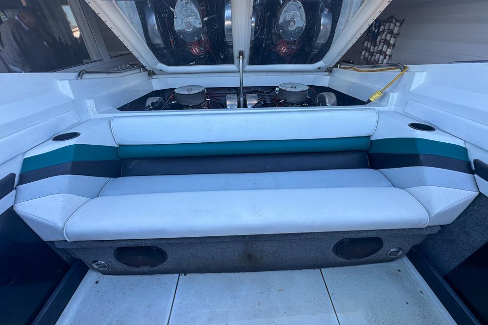 1989 Formula 292 SR-1 boat interior with engine compartment and cushioned seating.