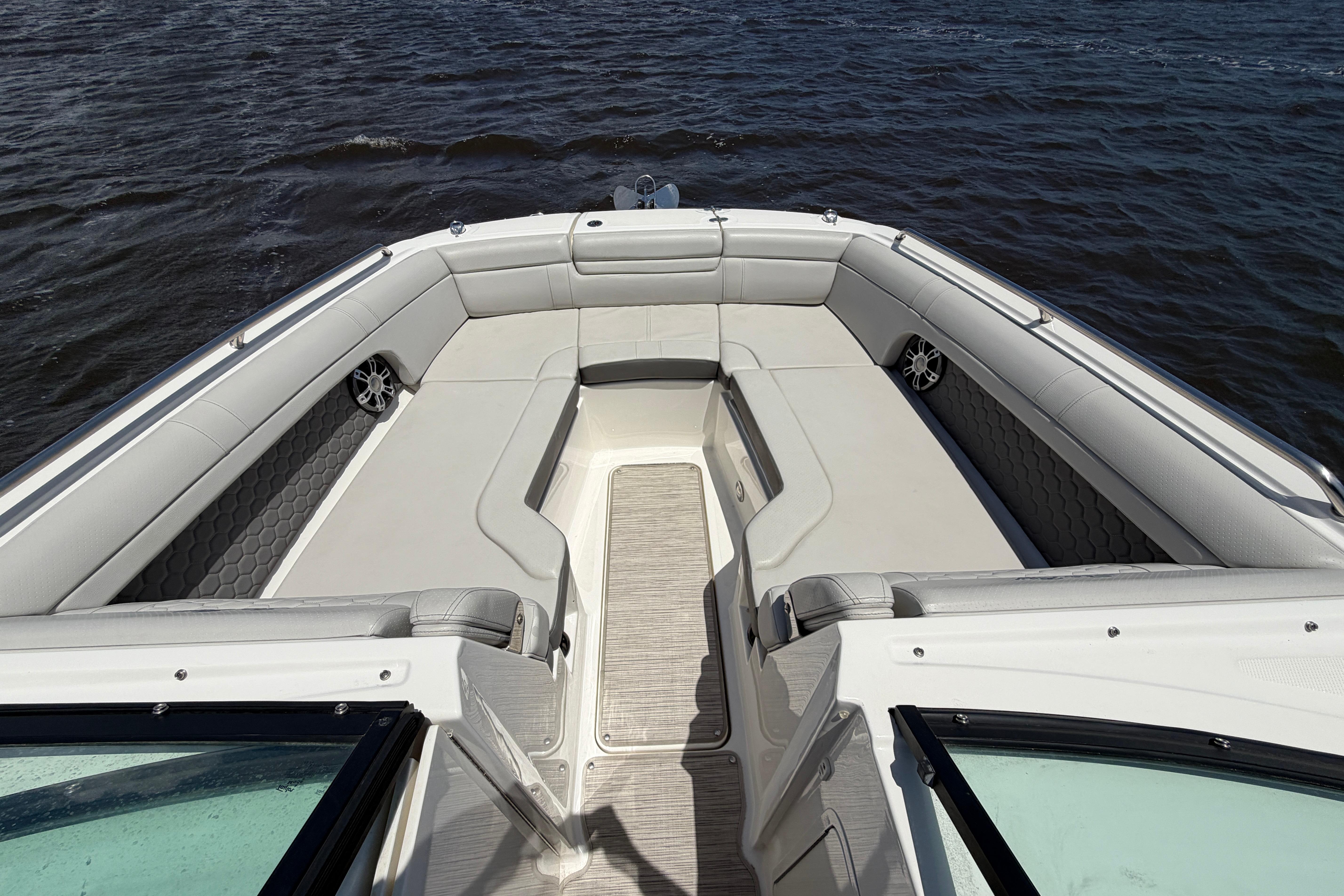 2024 Sea Ray SDX 270 Outboard boat interior with spacious seating on water.