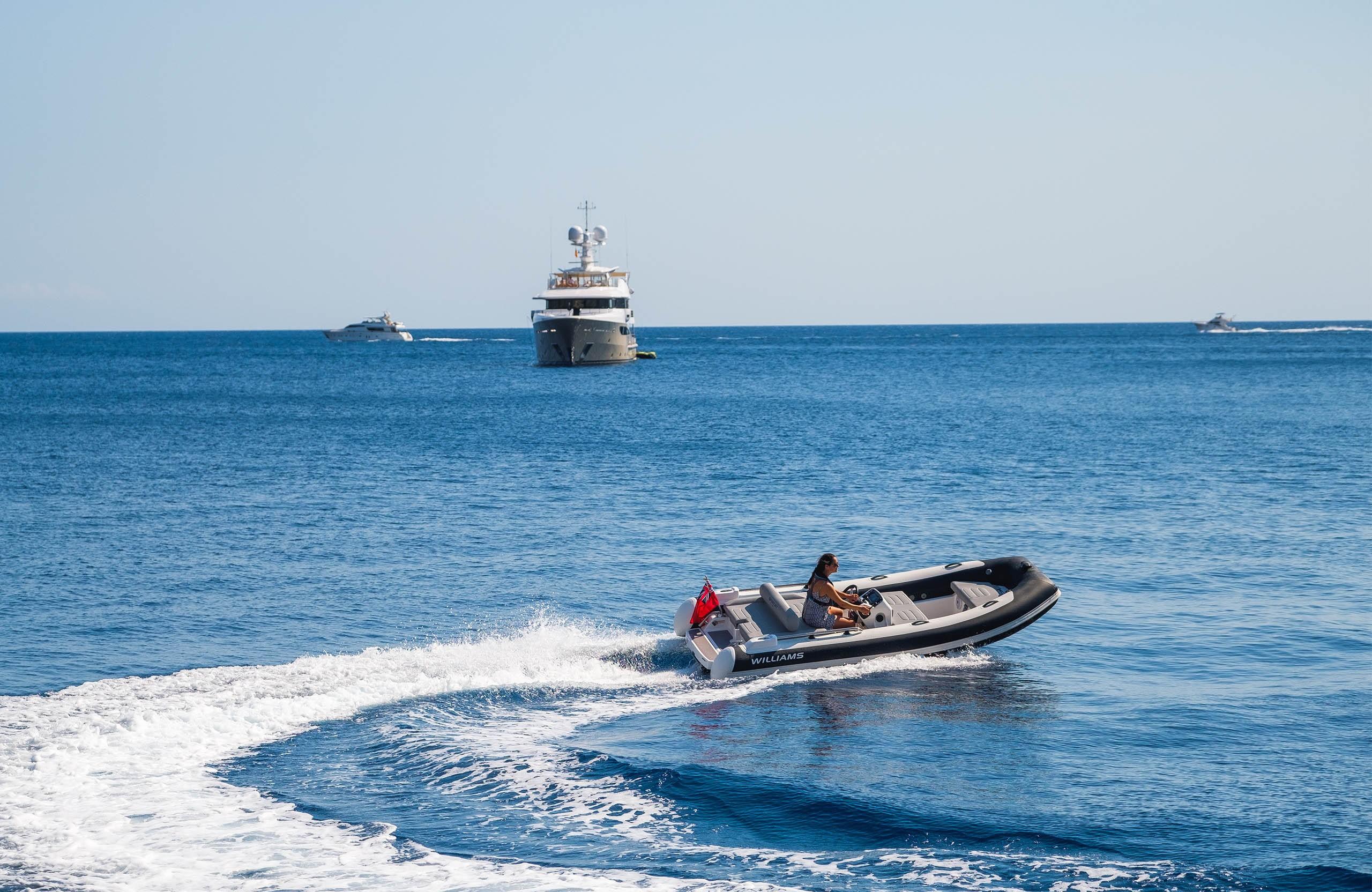 2025 Williams Jet Tenders Sportjet 435 cruising on open sea with yachts in background.