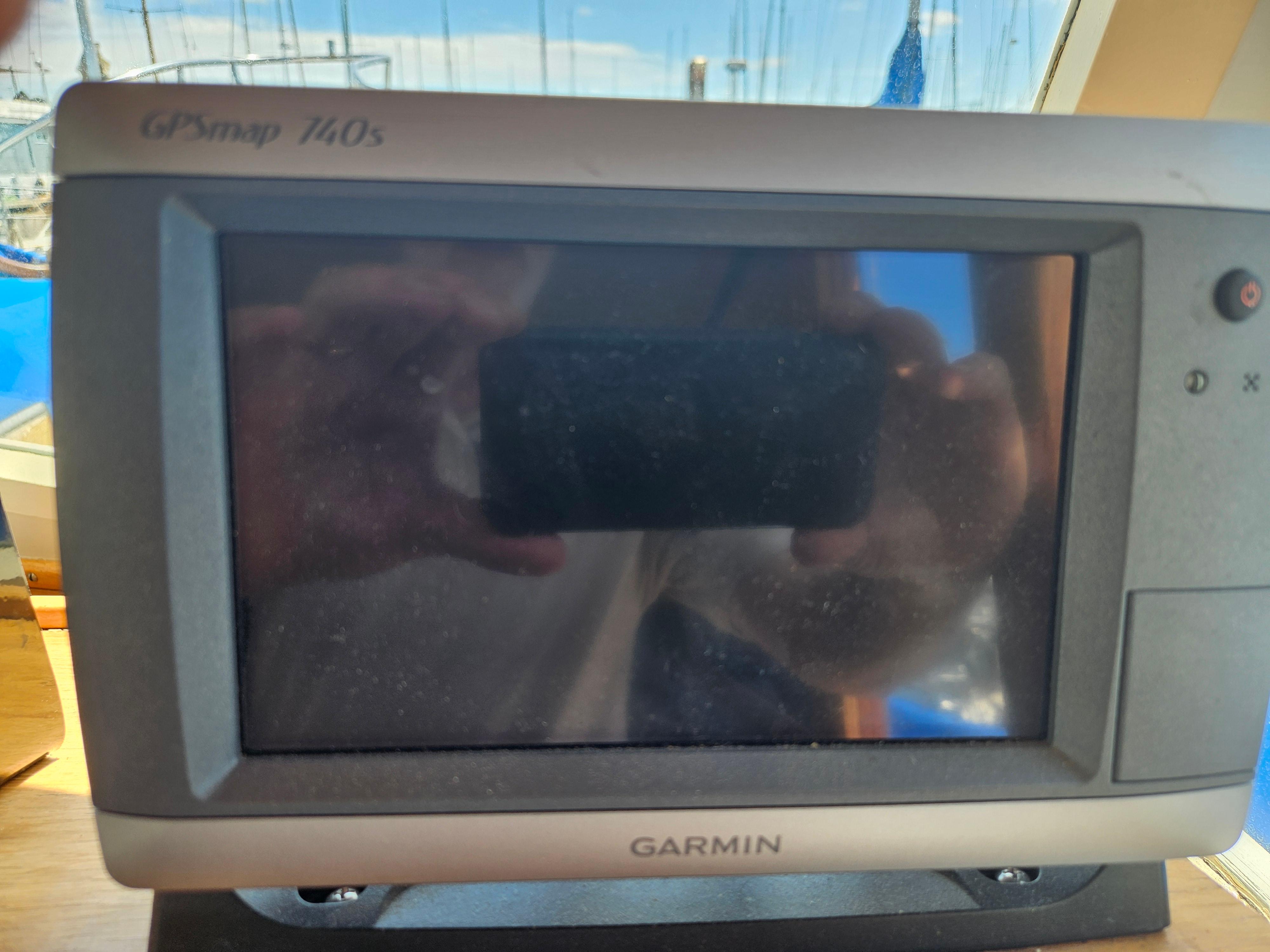Garmin GPSmap 140s on 1973 Grand Banks 36 Classic boat dashboard.