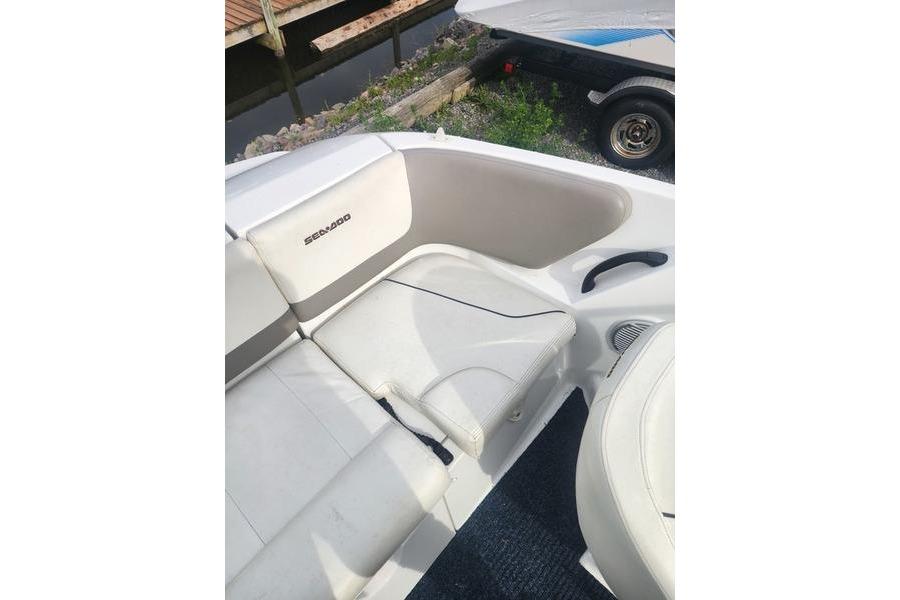2012 Sea-Doo Sport Boats 180 Challenger interior seating with white upholstery.