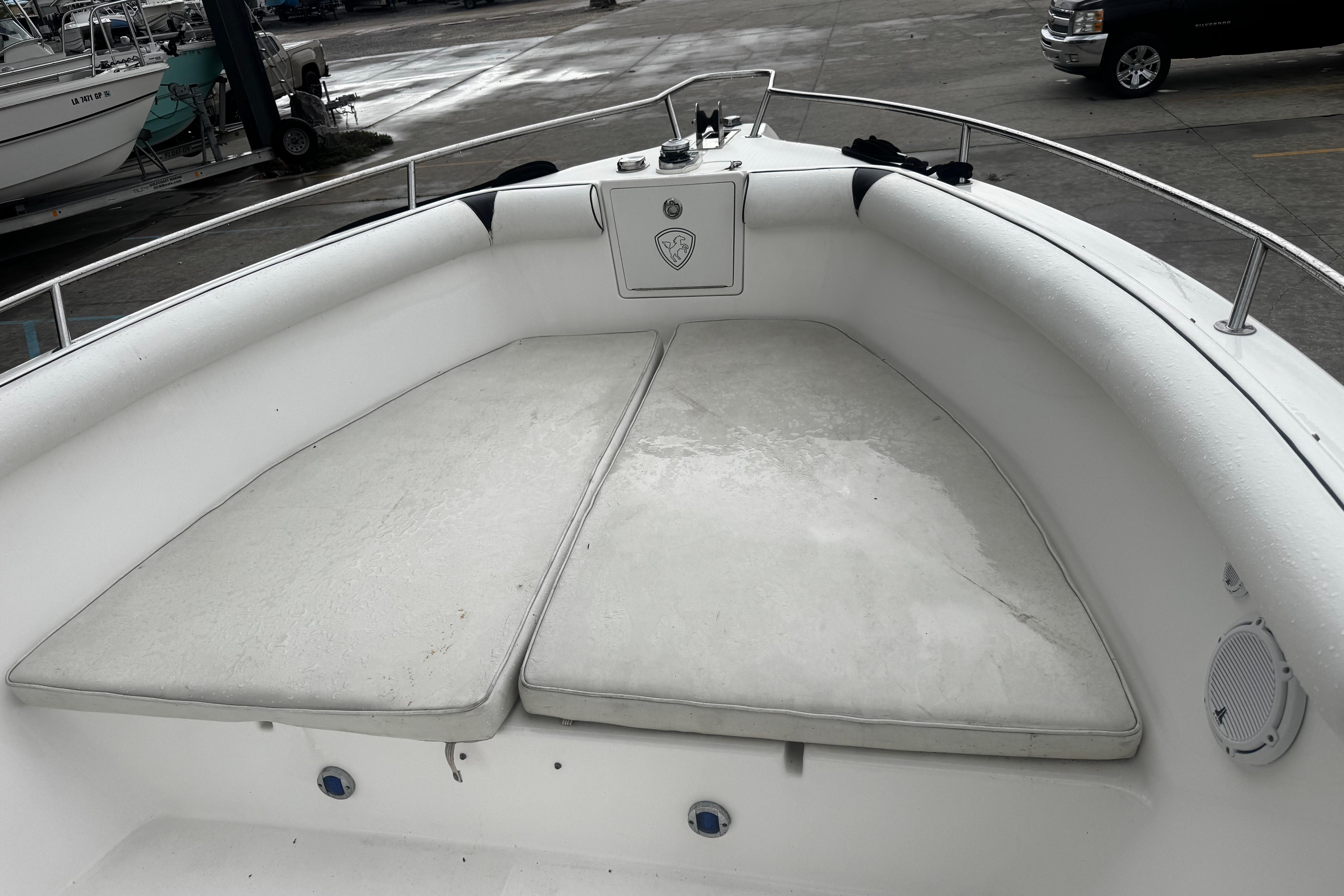 2004 Century 2900 Center Console boat interior with cushioned seating area.