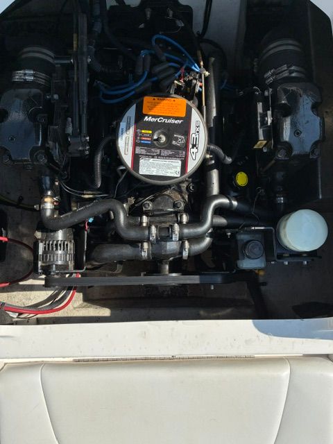 Engine compartment of a 2012 Chaparral 19 H2O Sport with a MerCruiser engine.
