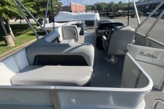 2026 Sun Tracker Party Barge 18 DLX pontoon boat with spacious seating and modern design.