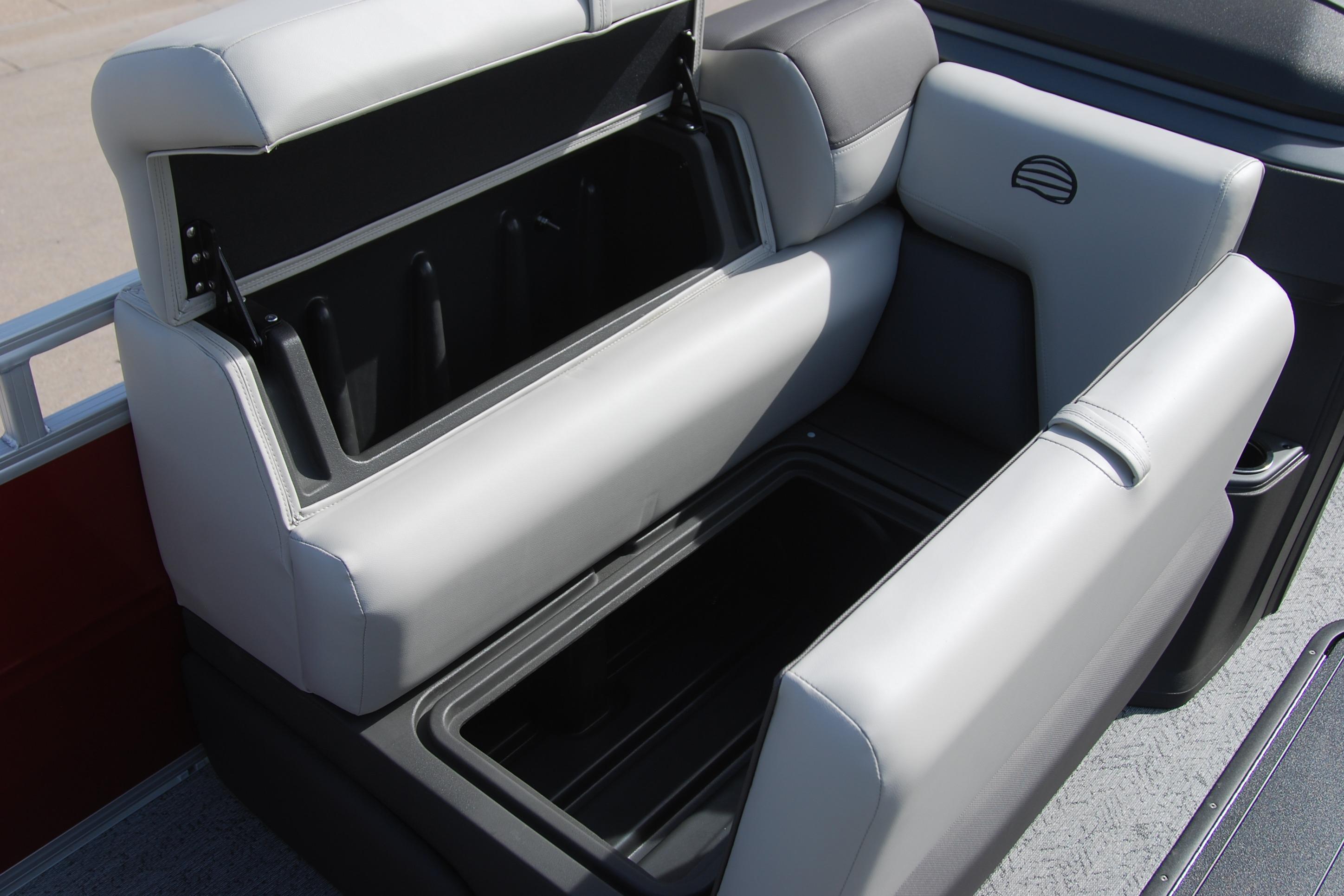 2026 Sun Tracker Fishin' Barge 22 XP3 storage compartment with open seat.