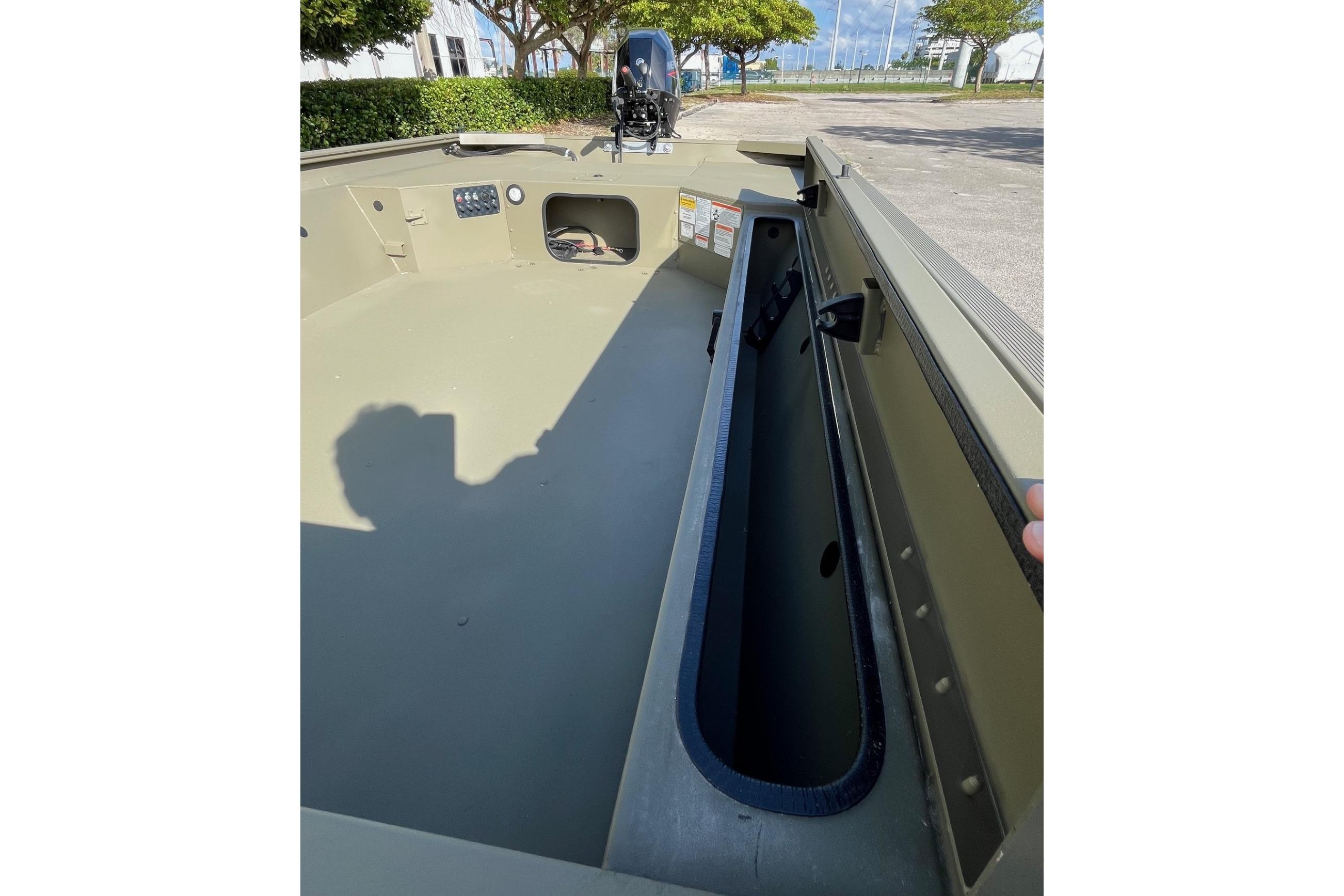 2026 Tracker Grizzly 1654 T Sportsman boat interior with storage compartment.