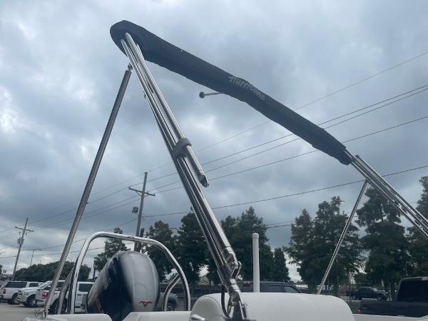 2022 Hurricane SS185 OB boat with bimini top under cloudy sky.