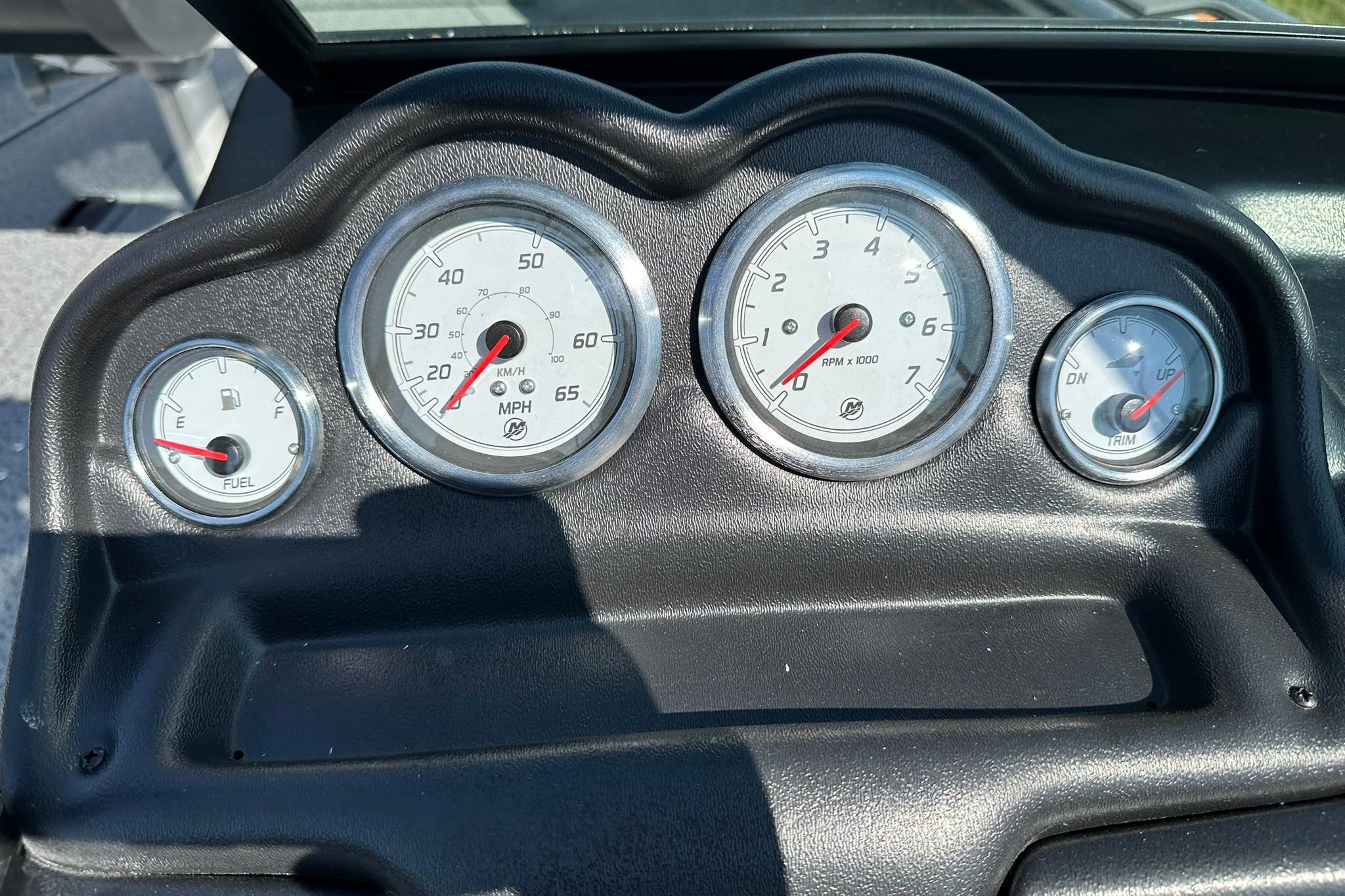Dashboard of 2026 Lund 1875 Fisherman boat with speedometer, fuel, and RPM gauges.