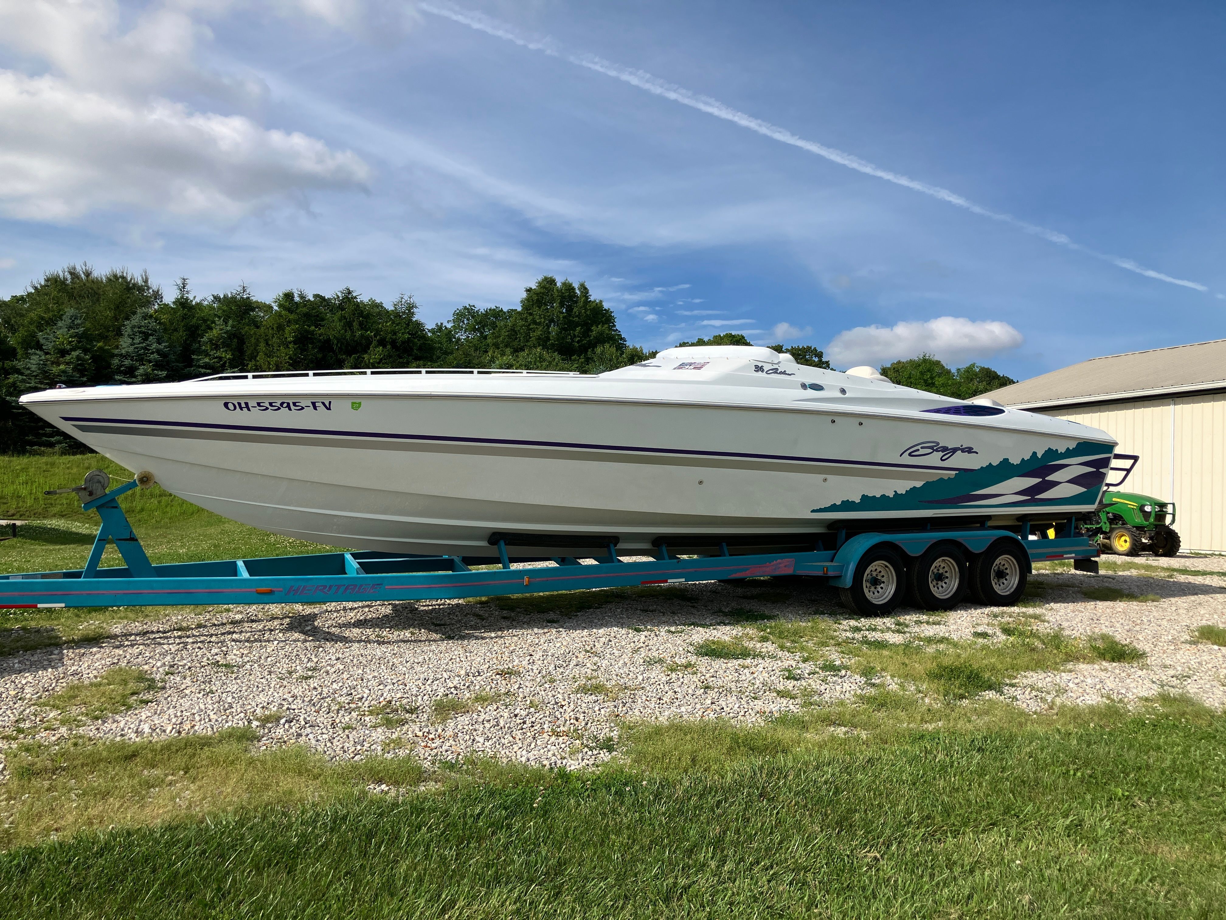 Baja 36 Outlaw 2000 on trailer parked outdoors.