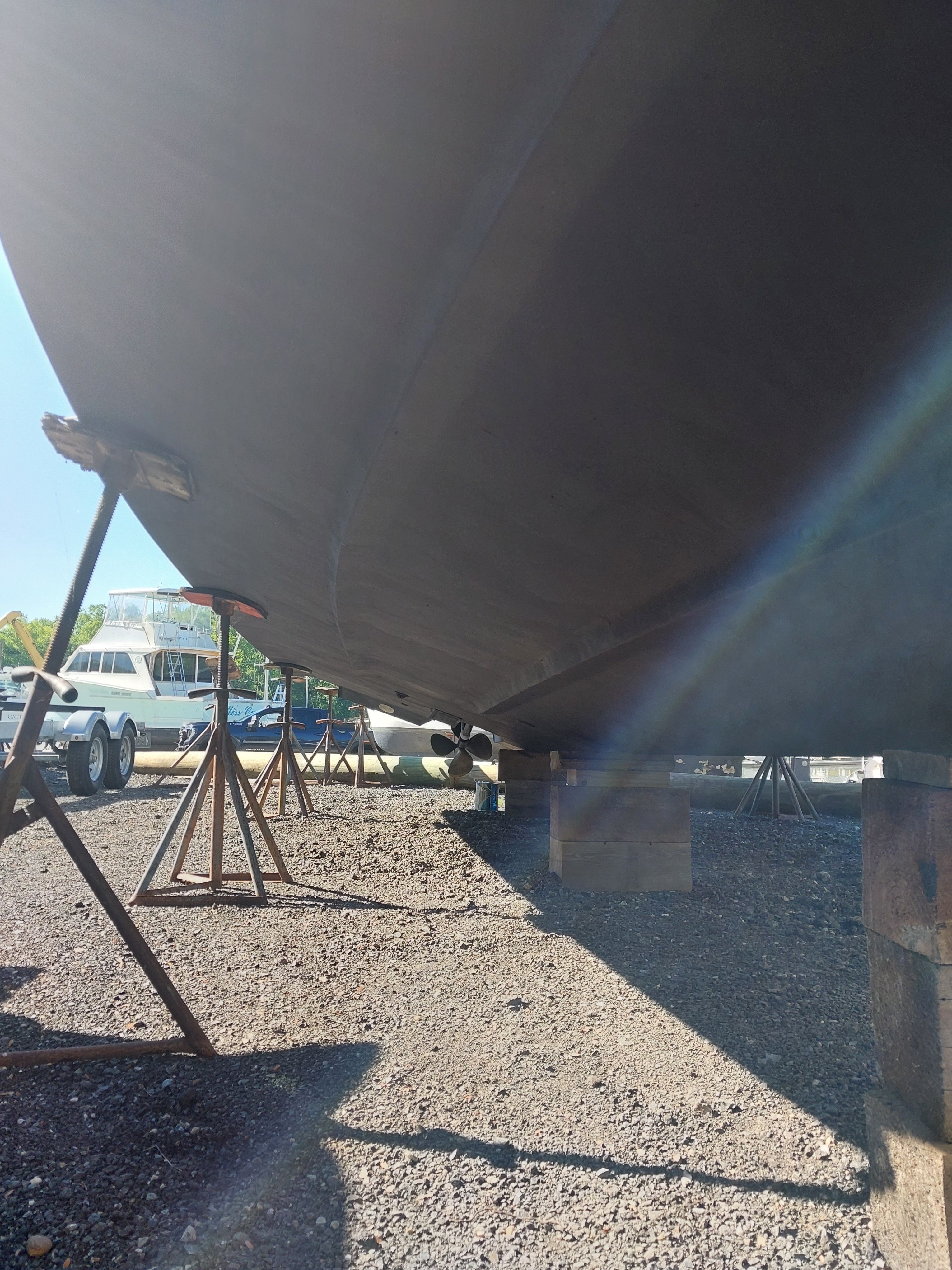 Underside of a 1991 Sea Ray 370 Sedan Bridge on stands.