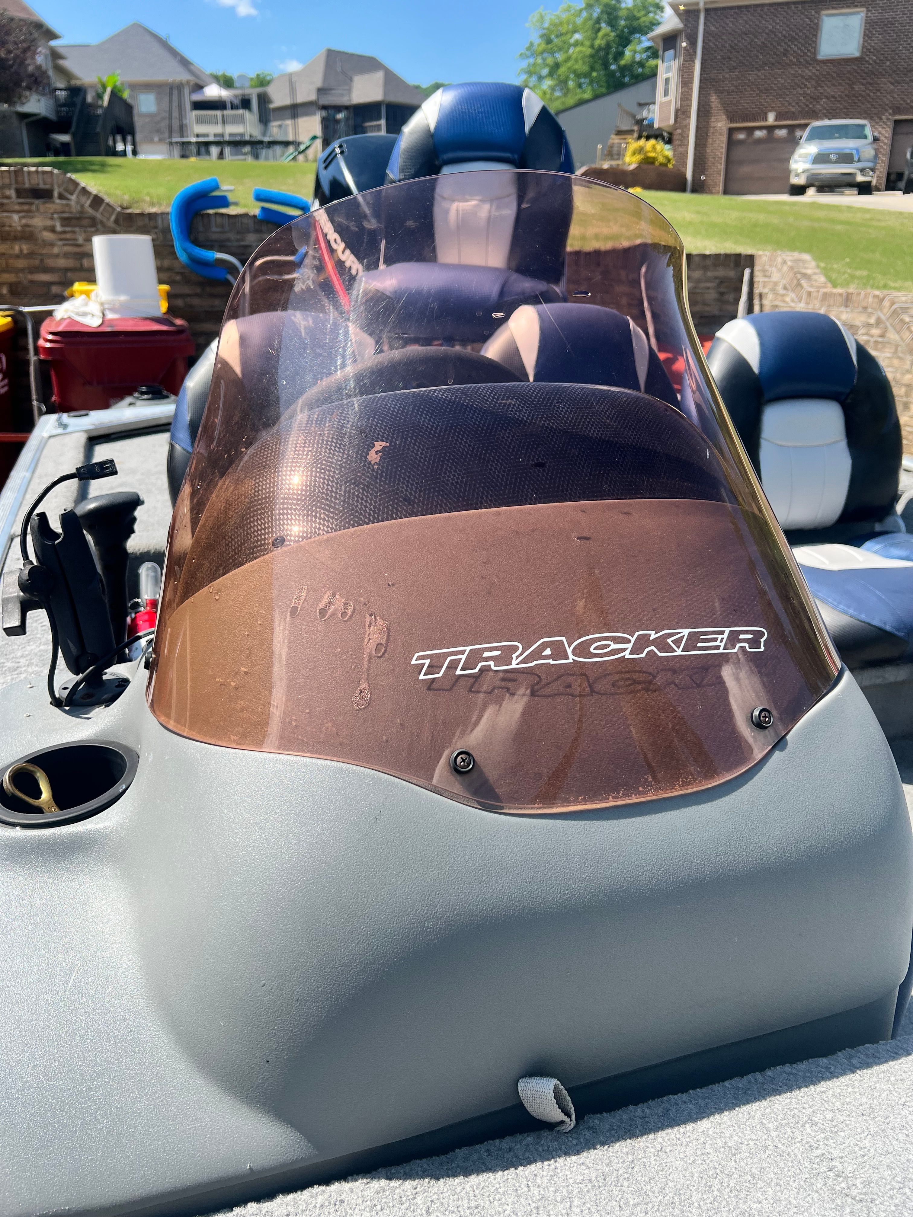 2007 Bass Tracker Pro 170 boat with windshield outdoors.