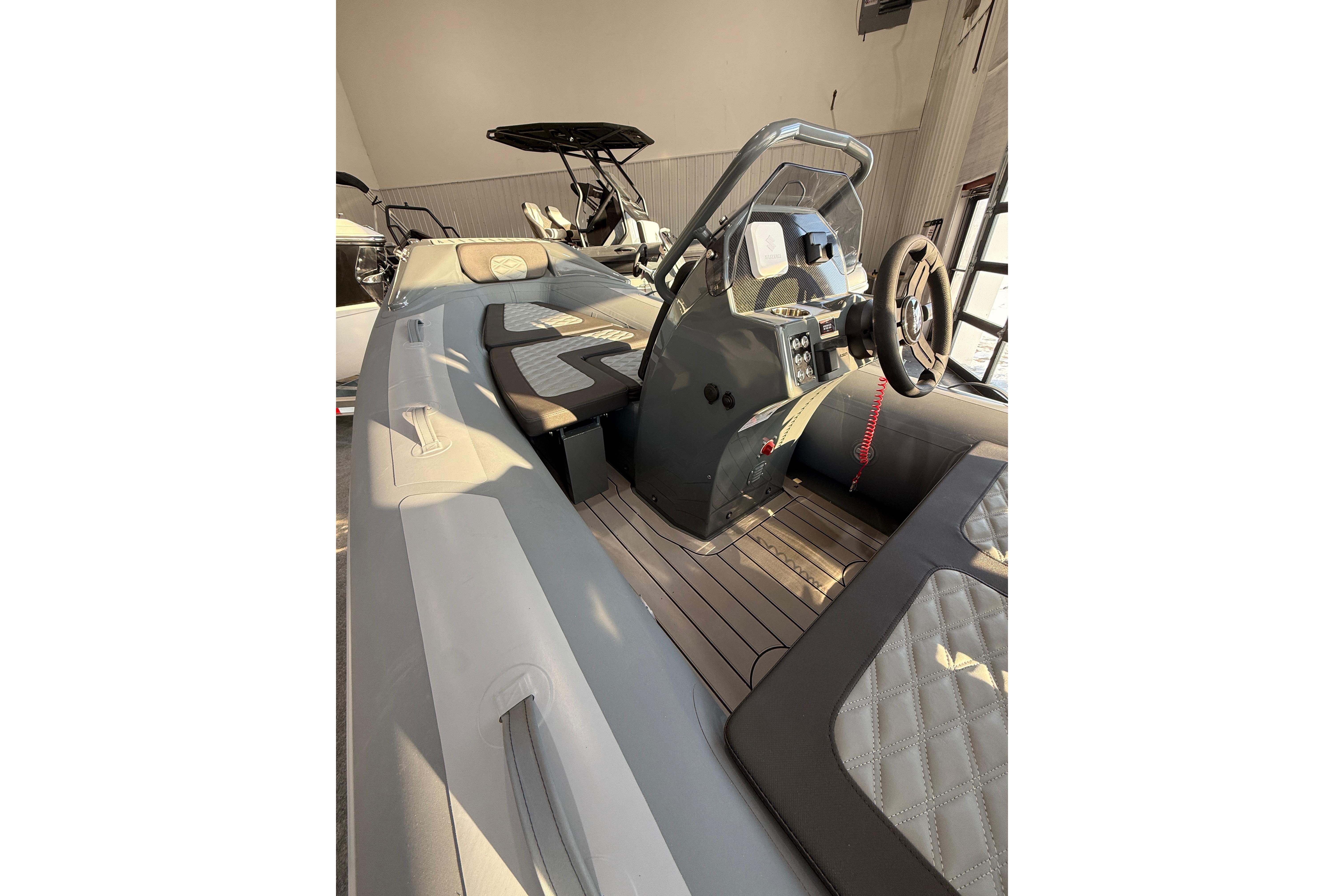 2026 Highfield Sport 390 boat interior with modern steering console and seating.