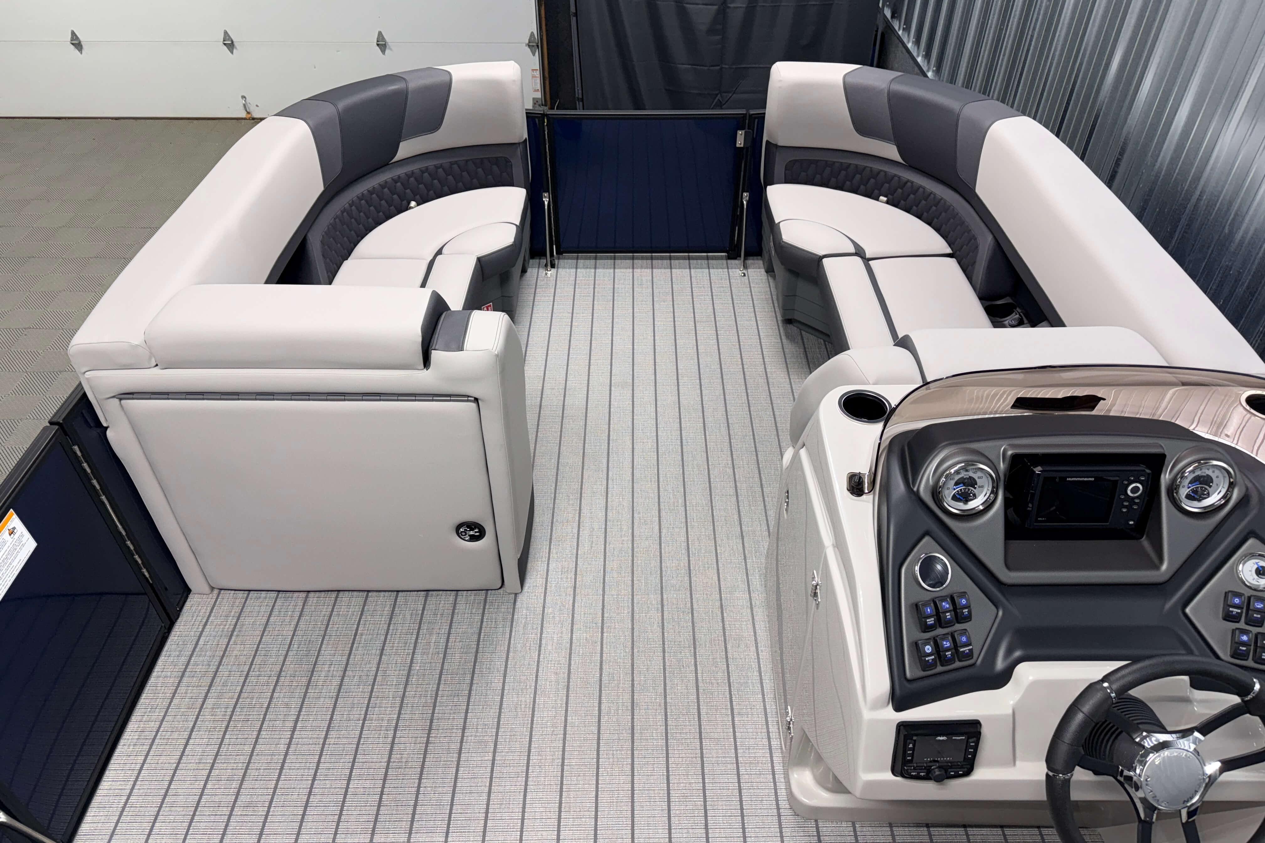 2026 Sylvan L3 SLZ pontoon boat interior with plush seating and modern helm controls.