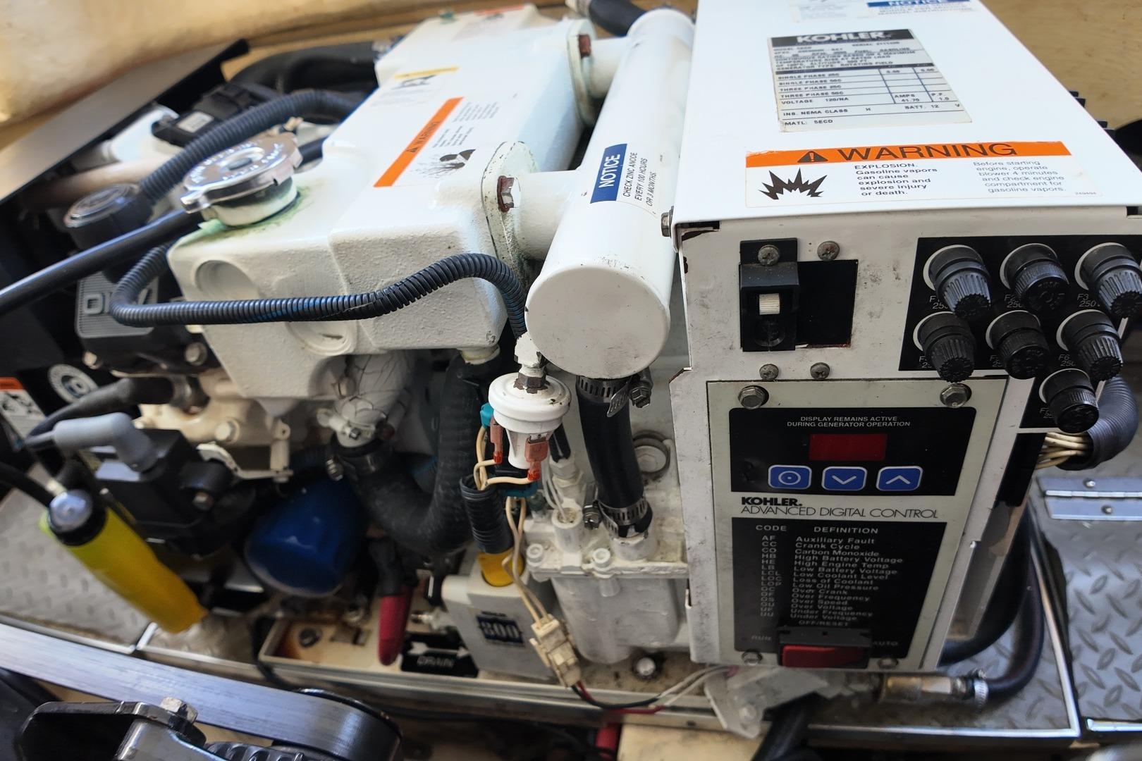Engine compartment of a 2007 Formula 330 Sun Sport with Kohler generator.