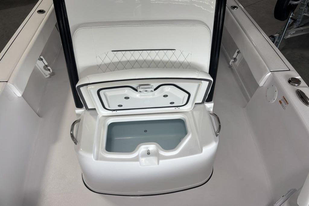2026 Sportsman Masters 247 Bay Boat with open storage compartment.