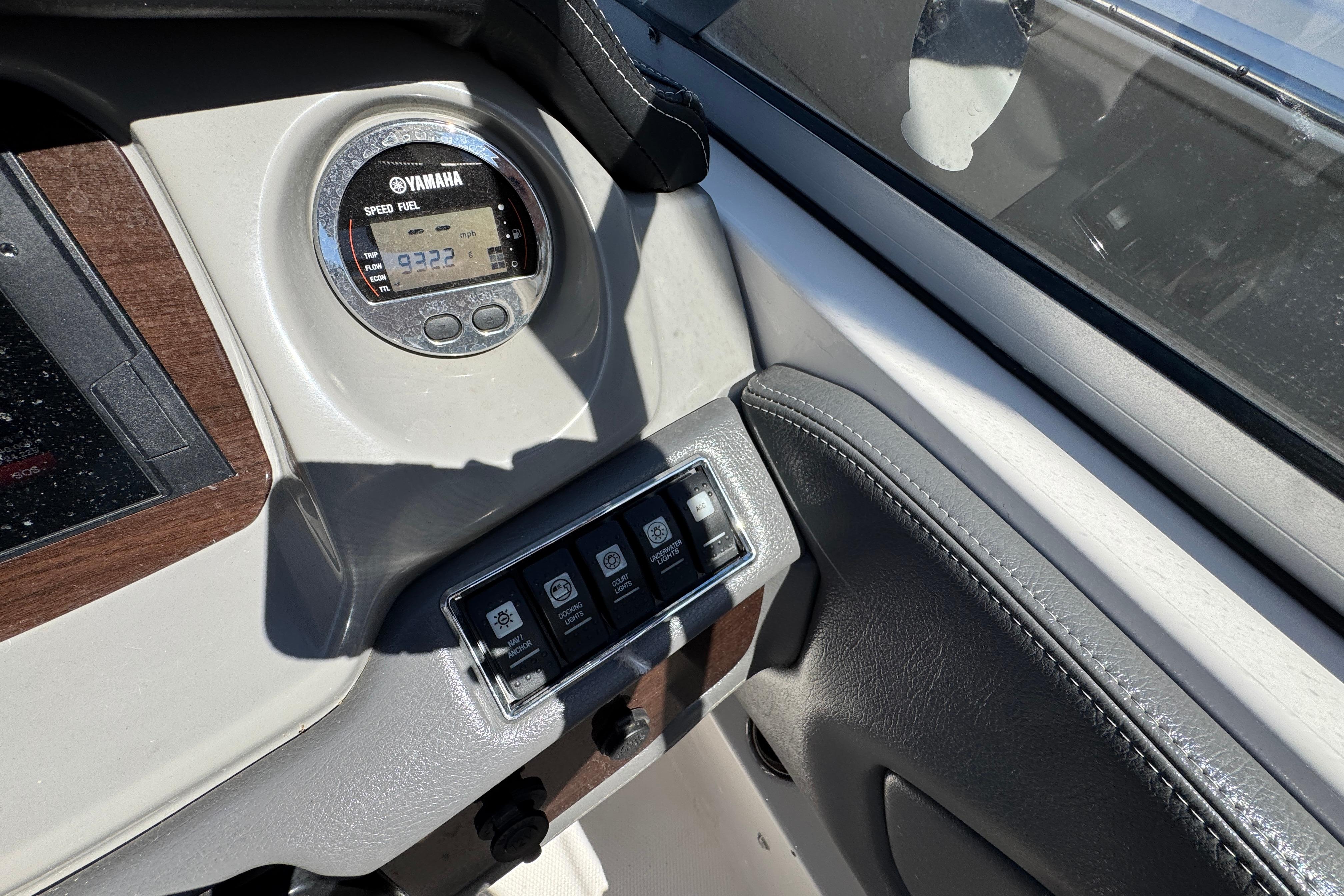 Dashboard of 2018 Chaparral 250 Suncoast boat with Yamaha gauge and control switches.