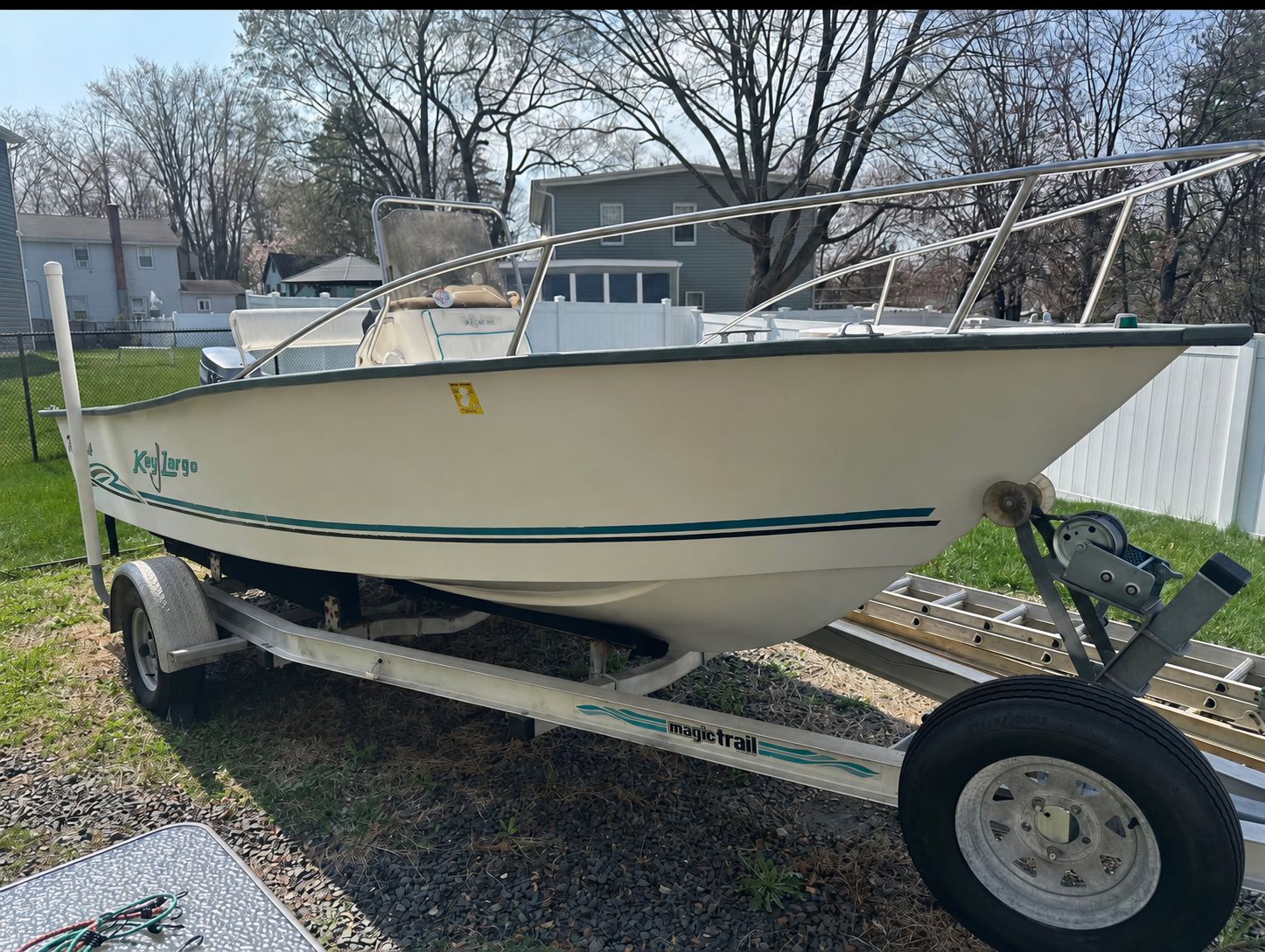 A 2003 Key Largo 180 Center Console boat is on a trailer outdoors.