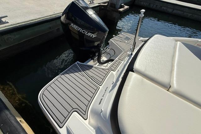 2022 Sea Ray SPX 210 Outboard boat with Mercury engine at dock.