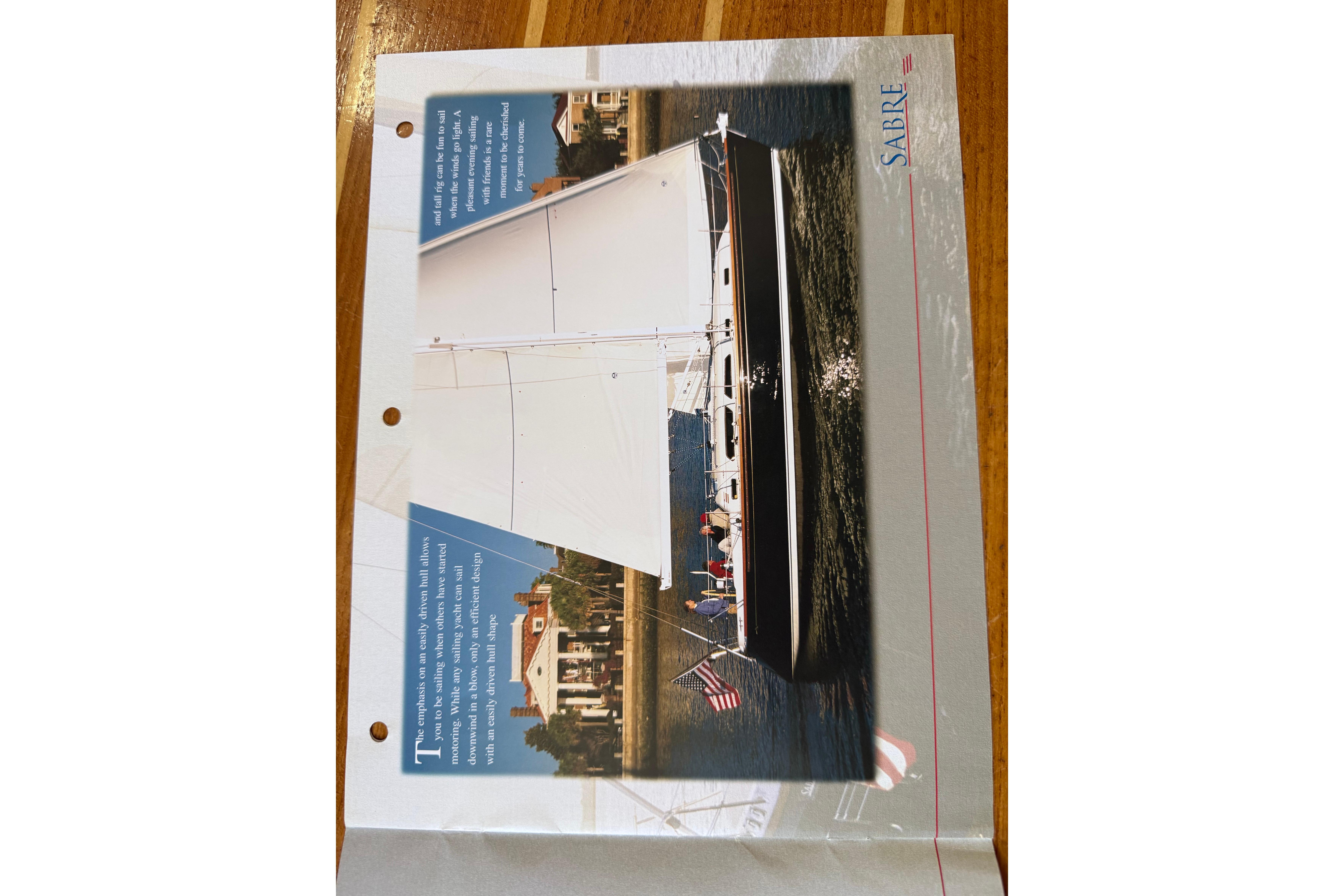 2004 Sabre 386 sailboat brochure featuring sleek design and sailing on water.