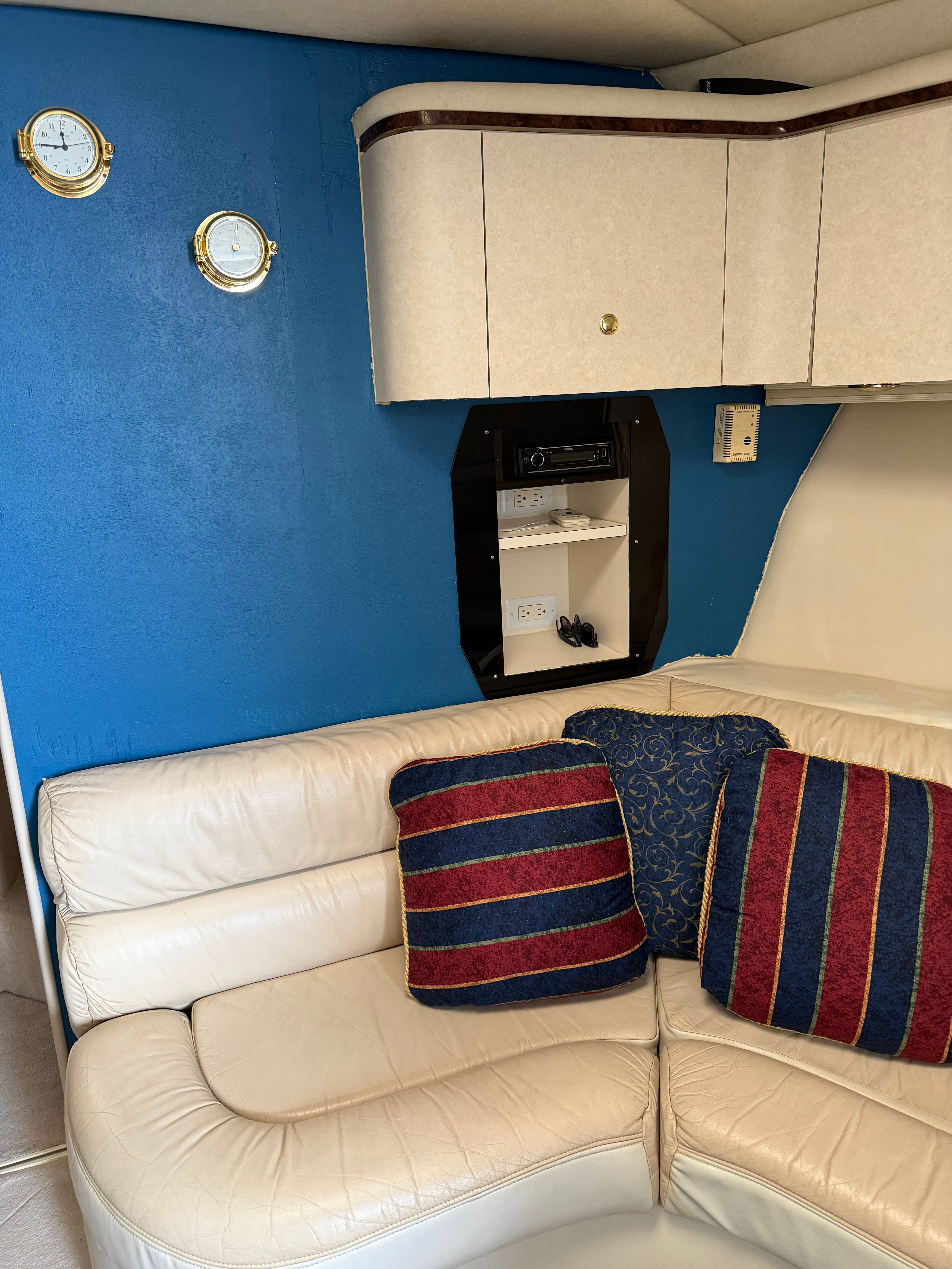 Interior of a 1997 Regal Commodore with blue and red cushions.